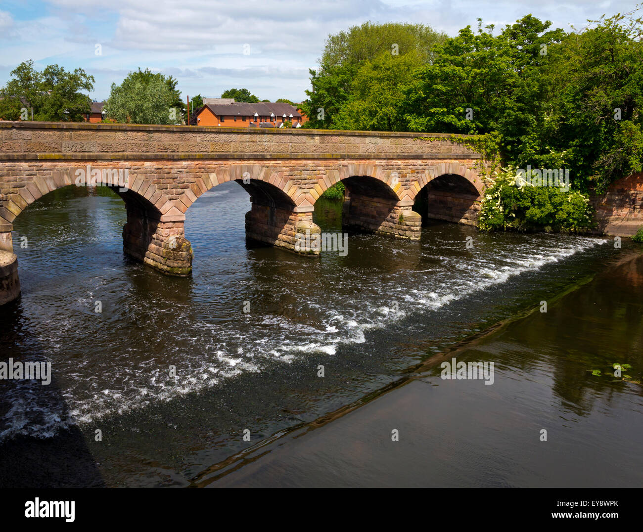 Weir and stone bridge on the Washlands flood plain of the River Trent