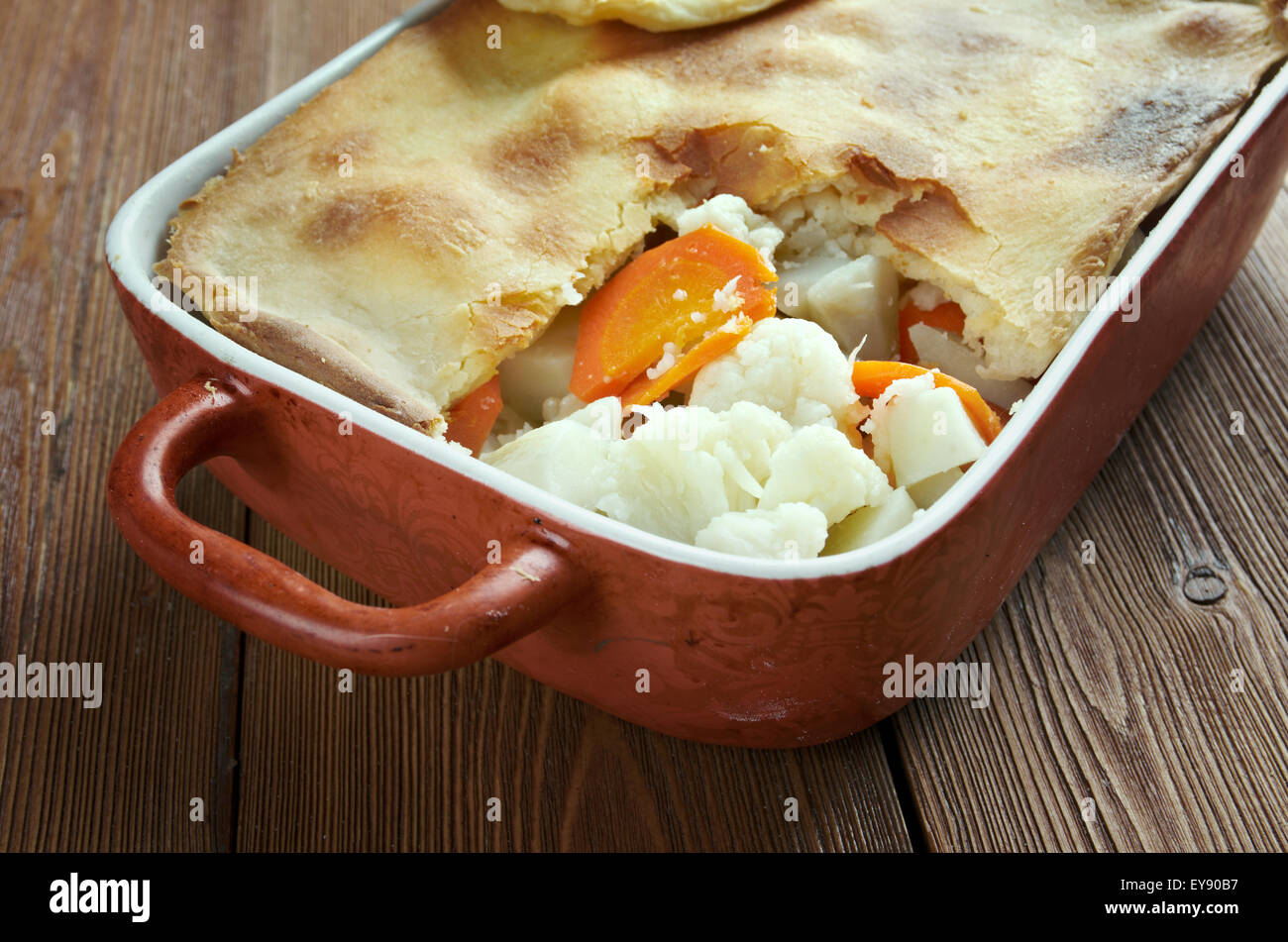 Woolton pie -  dish of vegetables, widely served in Britain. cooking potatoes (or parsnips), cauliflower, swede, carrots and, po Stock Photo