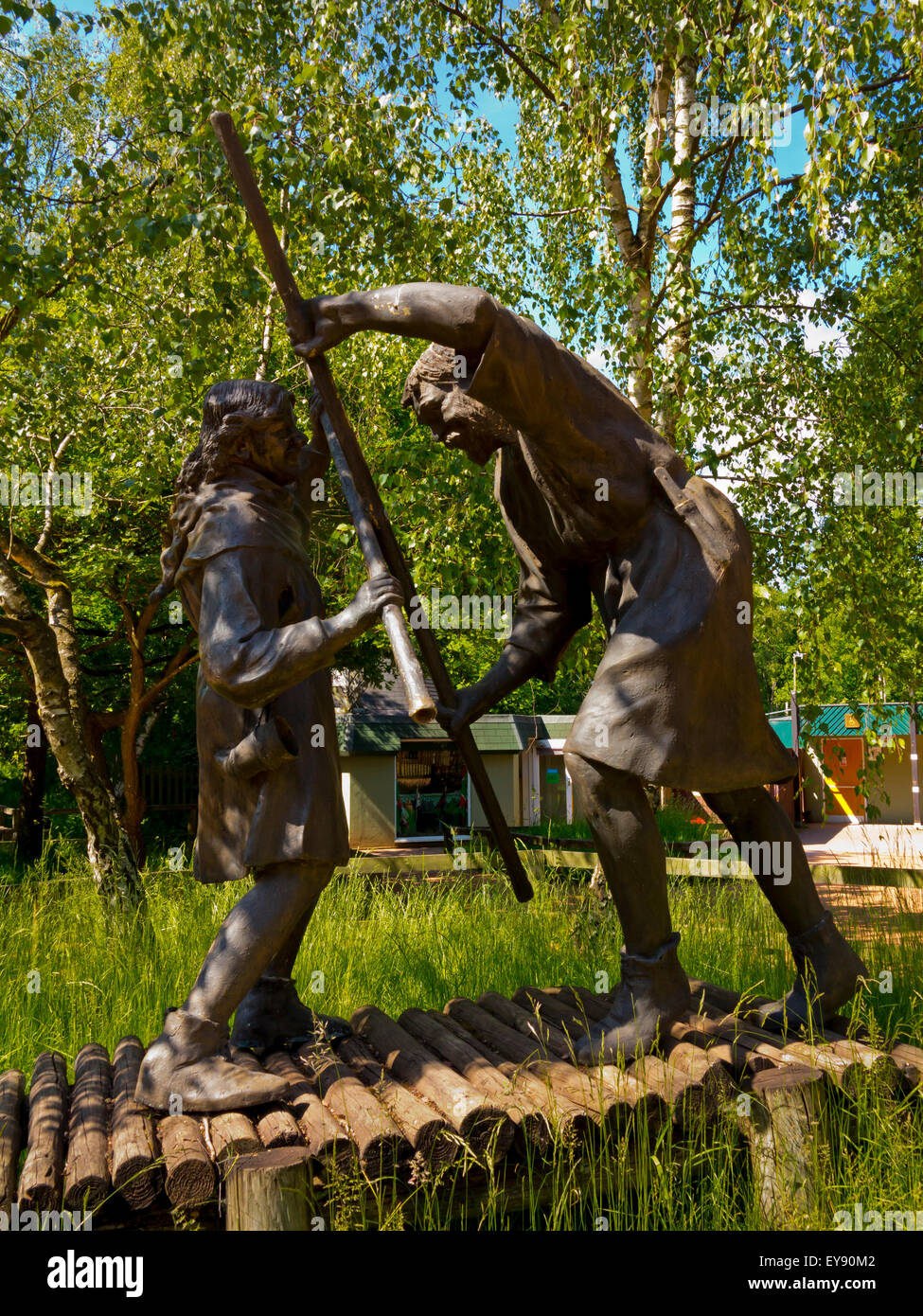 Sculpture of Robin Hood and Little John fighting at Sherwood Forest Visitor Centre Edwinstowe Nottinghamshire England UK Stock Photo