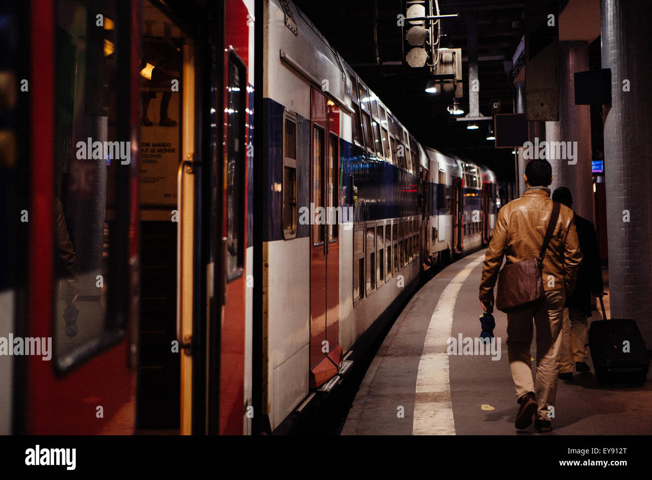 Commute getting off a train in Paris. Stock Photo
