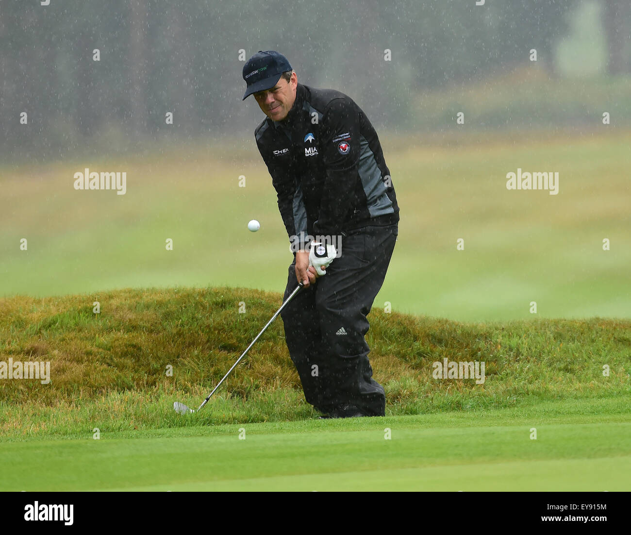 Sunningdale, Berkshire, UK. 24th July, 2015. Seniors Open Golf Tournament Round 2. Malcolm Mackenzie (ENG) chips in to 16 on a very wet day that sees play abandoned for the day due to standing water on greens and fairways. Credit:  Action Plus Sports/Alamy Live News Stock Photo