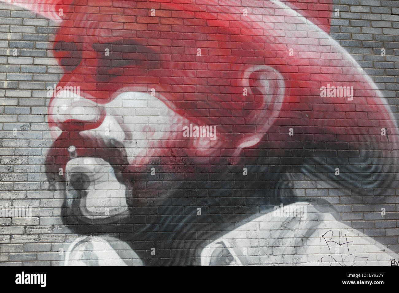 Hoxton, London: Street art, Man with stetson hat on brick wall Stock Photo