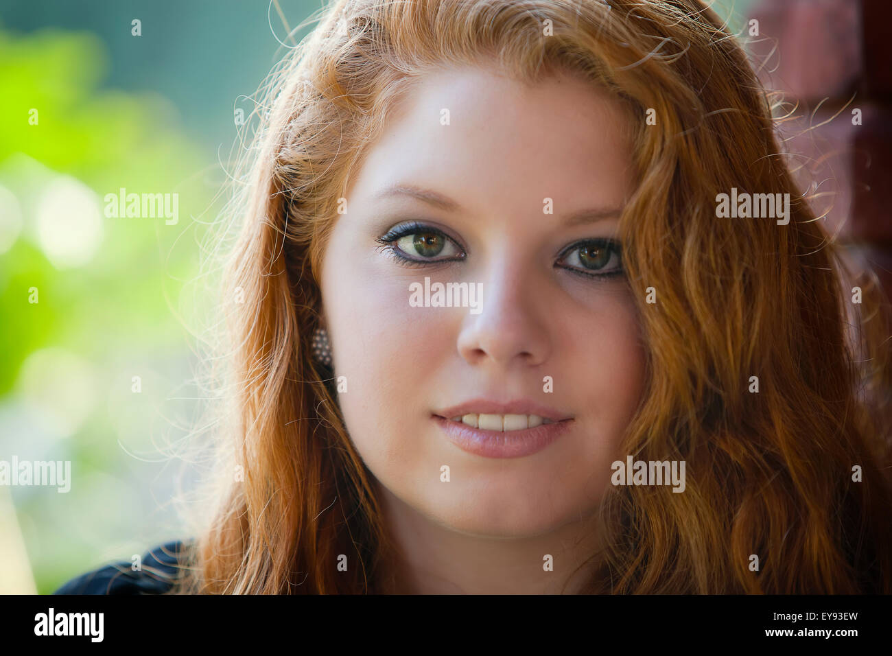 Portrait of a young woman with long red hair; United States of America ...