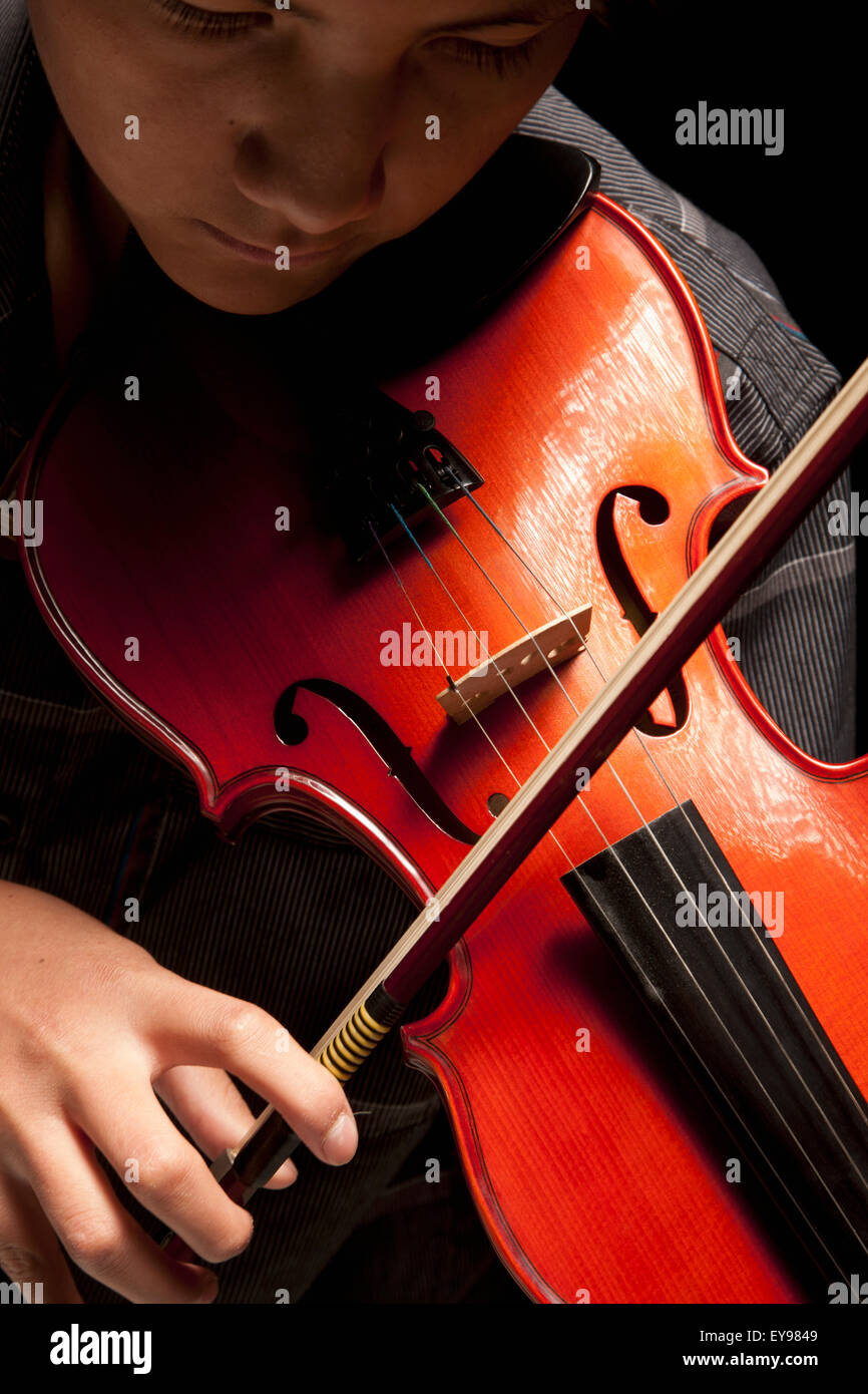 Boy playing violin; Edmonton, Alberta, Canada Stock Photo Alamy