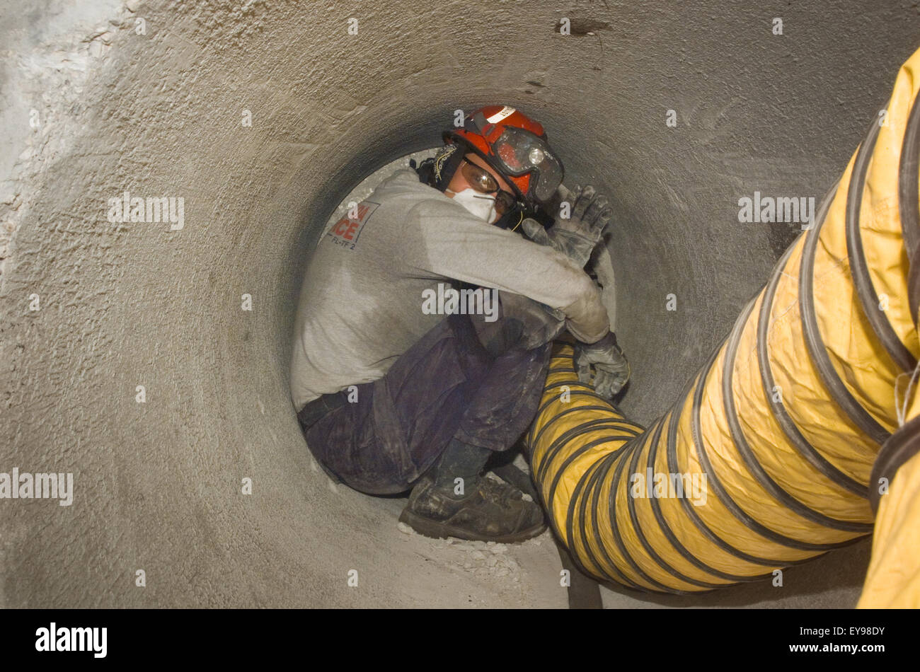 Member of Urban Search and Rescue Team training in a simulated building collapse. Stock Photo