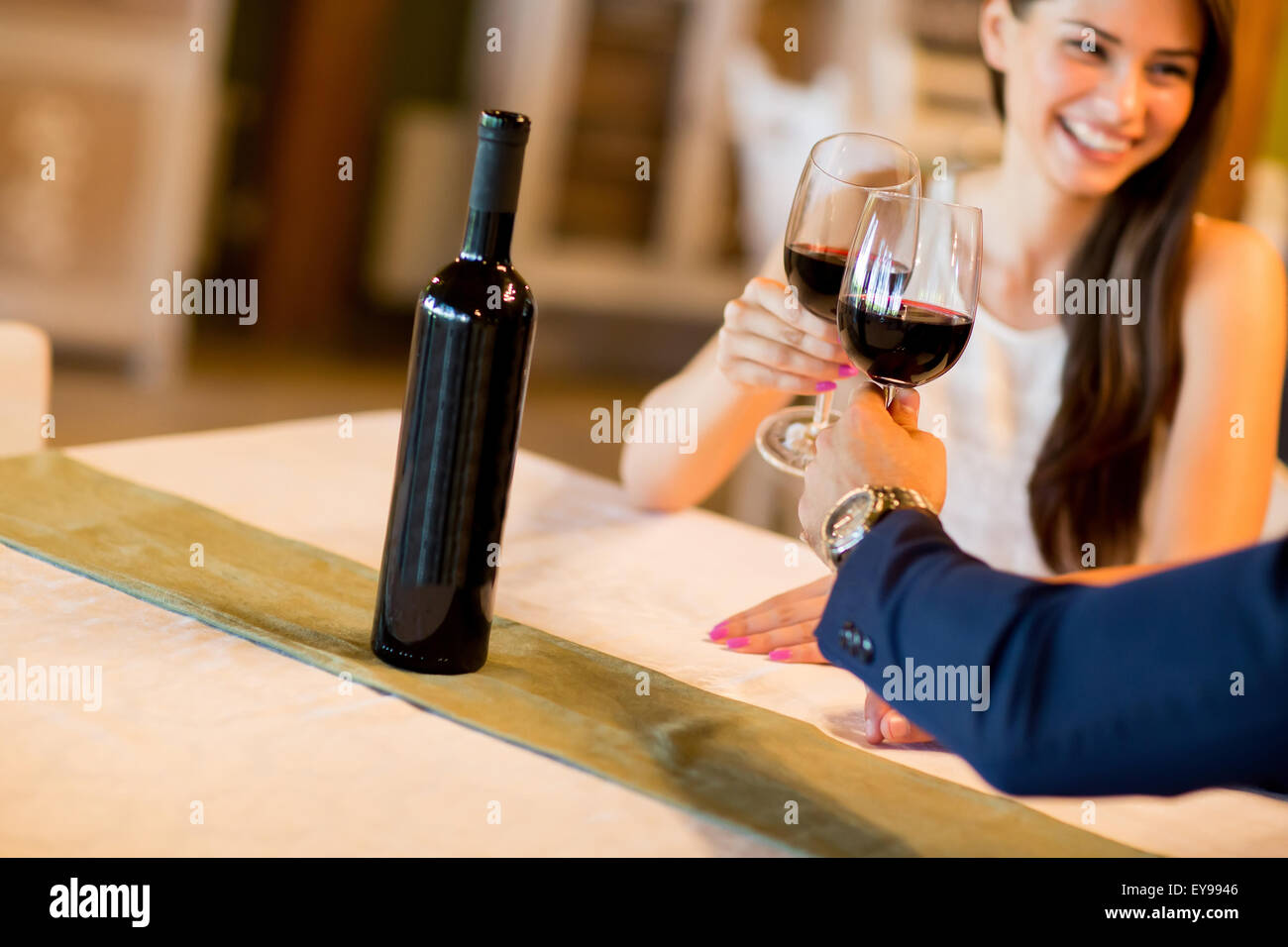 Young couple drinking red wine Stock Photo - Alamy