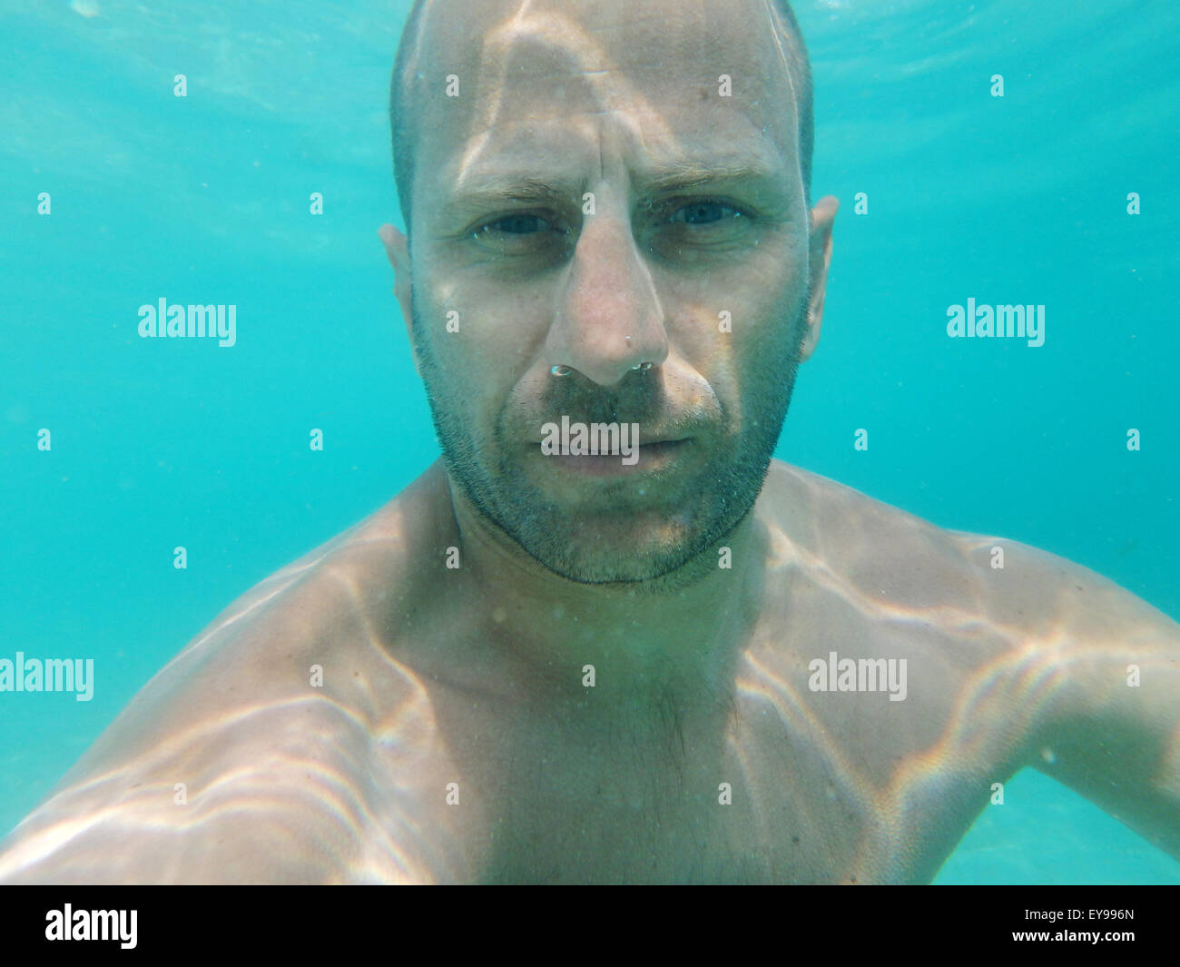 Man below the surface of the sea, underwater photography. Stock Photo