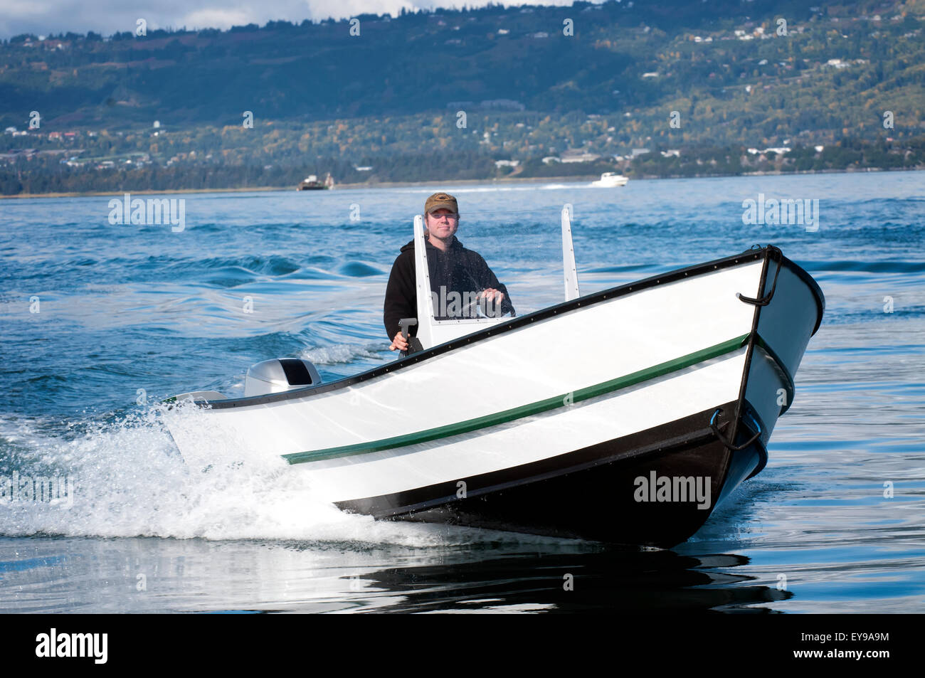 Man drives his newlybuilt Tolman Skiff Standard near the Homer Spit on