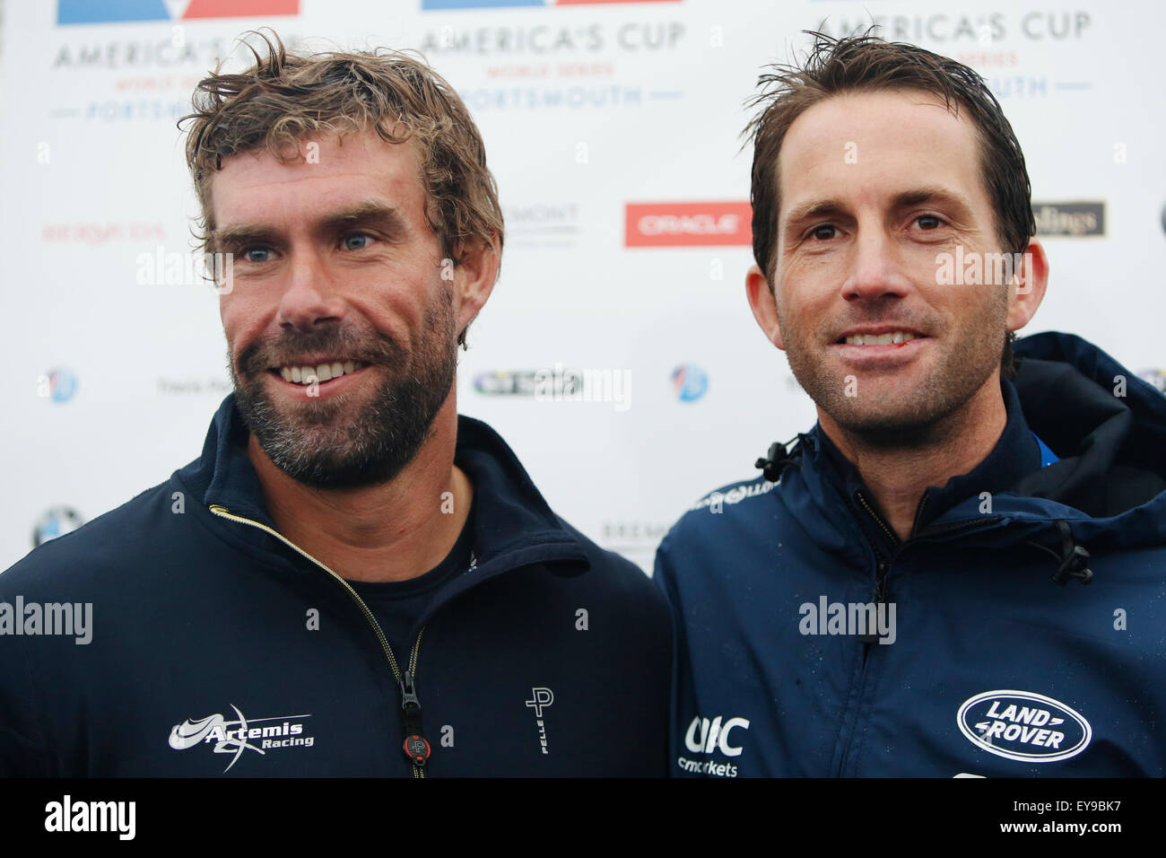 Portsmouth, UK. 24th July, 2015. Tactician Iain Percy of Sweden's Artemis Racing and Britain's Skipper Ben Ainslie of Land Rover BAR (Ben Ainslie Racing) speak to media after the practice racing ahead of the 35th America's Cup World Series Races at Portsmouth in Hampshire, UK Friday July 24, 2015. The 2015 Portsmouth racing of the Louis Vuitton America's Cup World Series counts towards the qualifiers and playoffs which determine the challenger to compete against the title holders Oracle Team USA in 2017. Credit:  Luke MacGregor/Alamy Live News Stock Photo