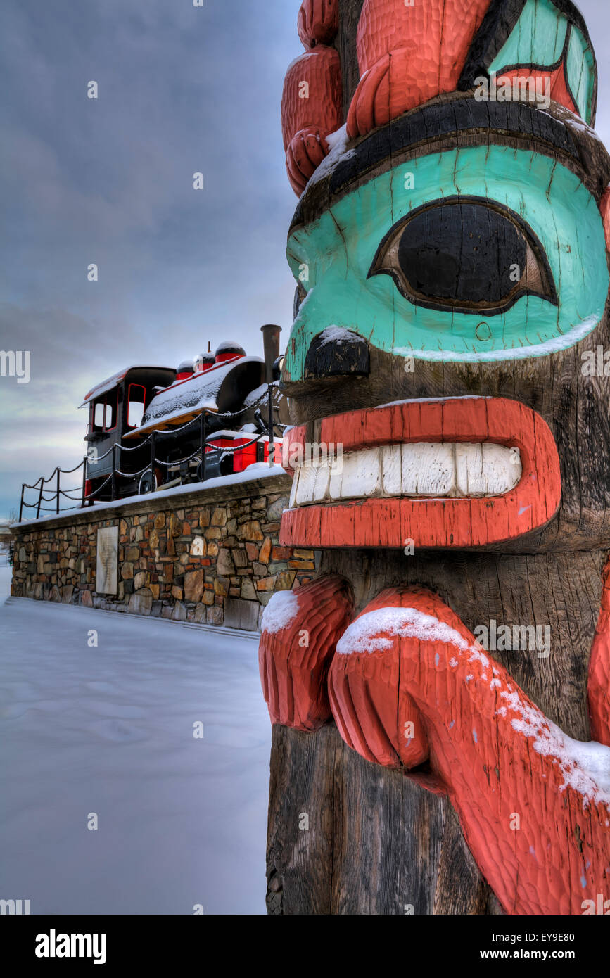 Totem pole and train at the Alaska Railroad Depot in Anchorage