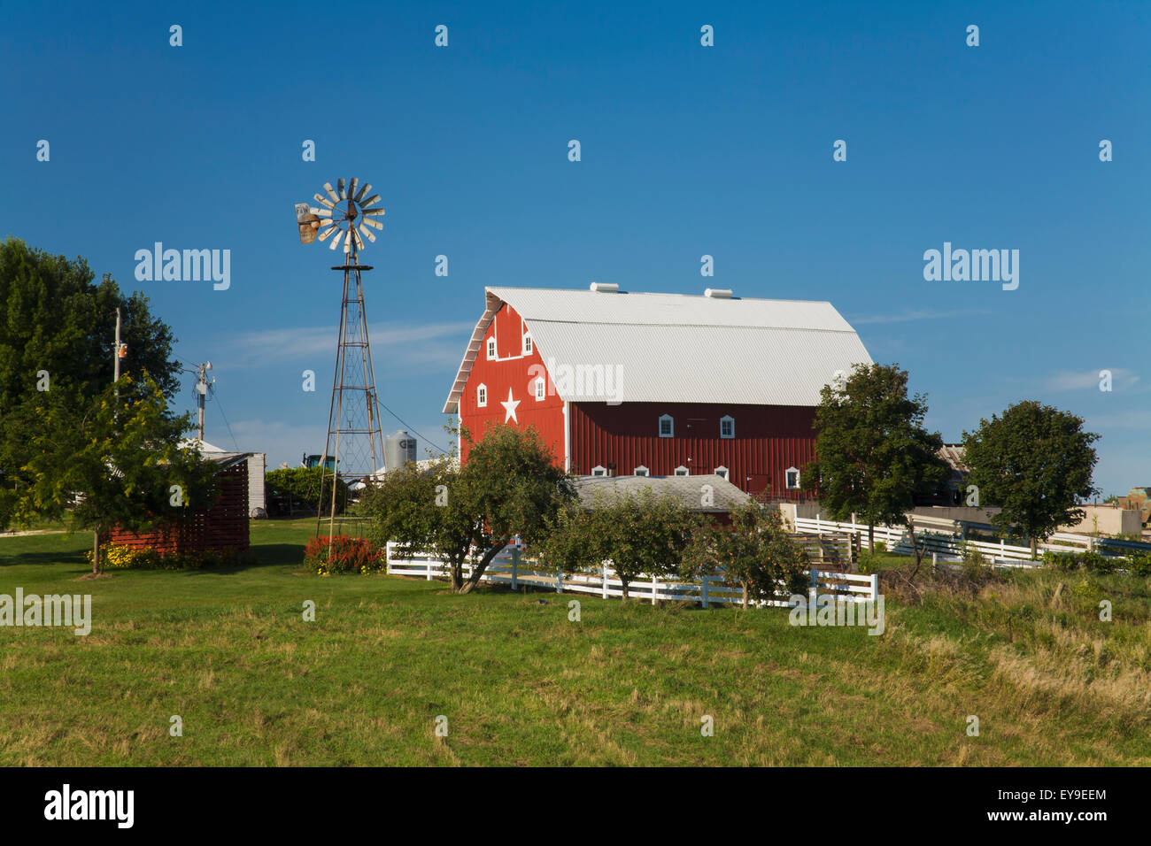 Red Barn And Windmill At A Farm Near Edgewood Iowa United