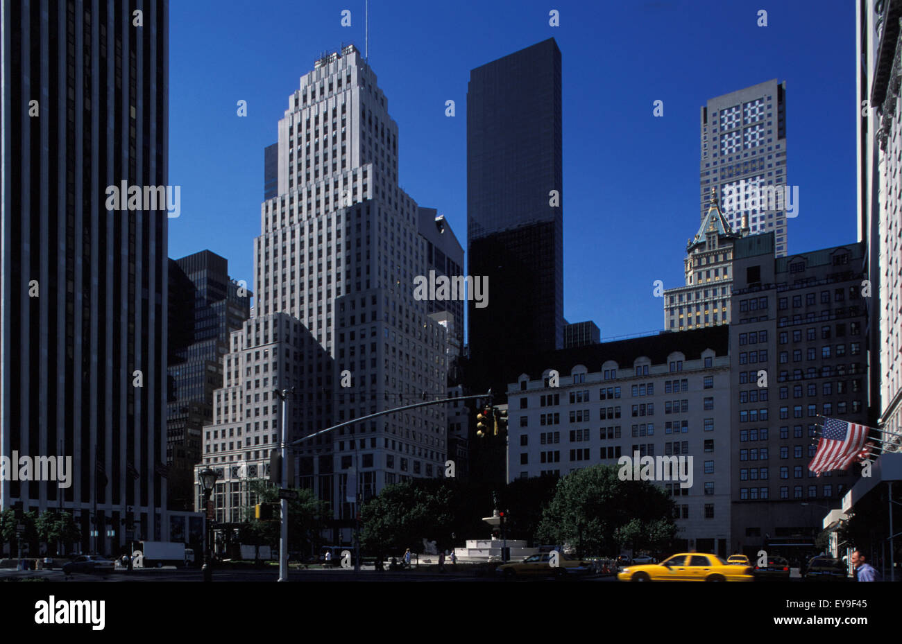 View Of Midtown's Skyline With Yellow Taxi Stock Photo