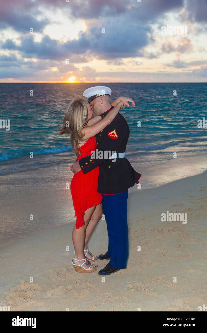 Marine and his lady getting engaged on the beach; Kailua, Island of Hawaii, Hawaii, United States of America Stock Photo