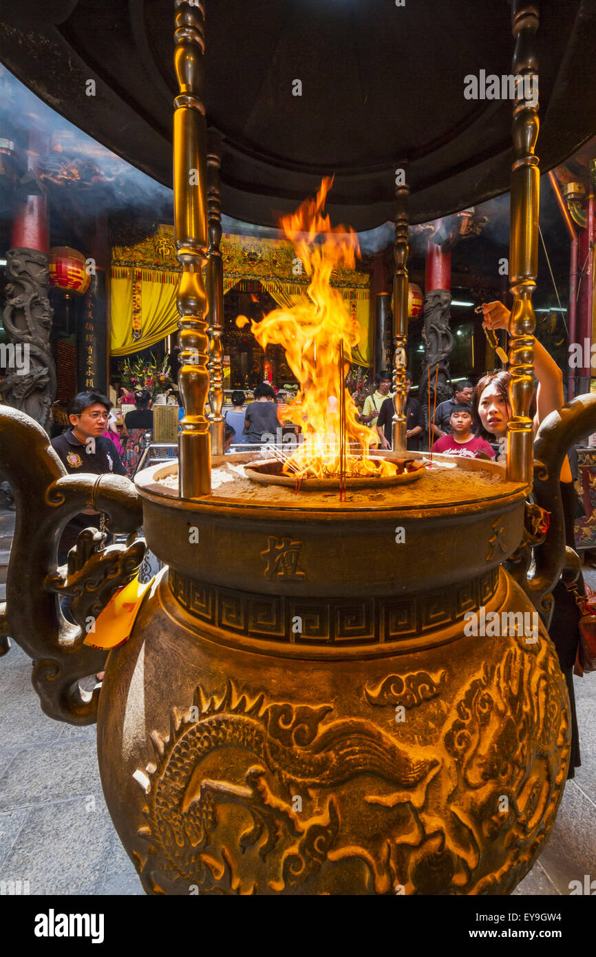 Incense and paper offerings burning in an incense burner at the Altar of Heaven (Tiantan); Tainan, Taiwan Stock Photo