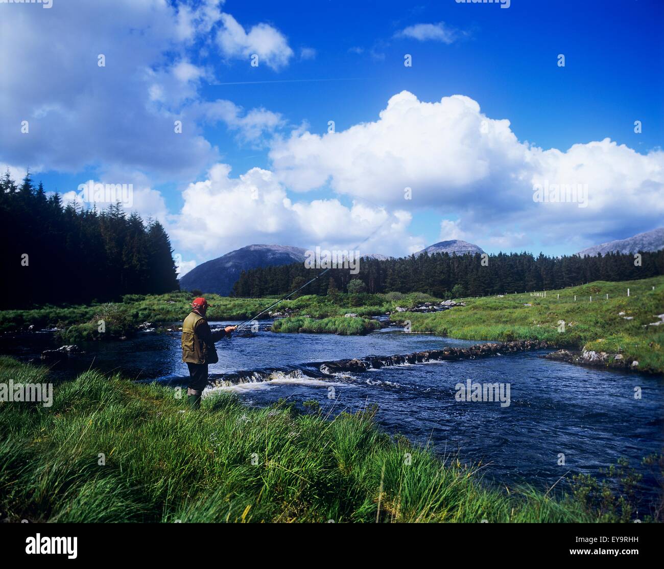 Side Profile Of A Man FlyFishing In A River, Connemara, County Galway