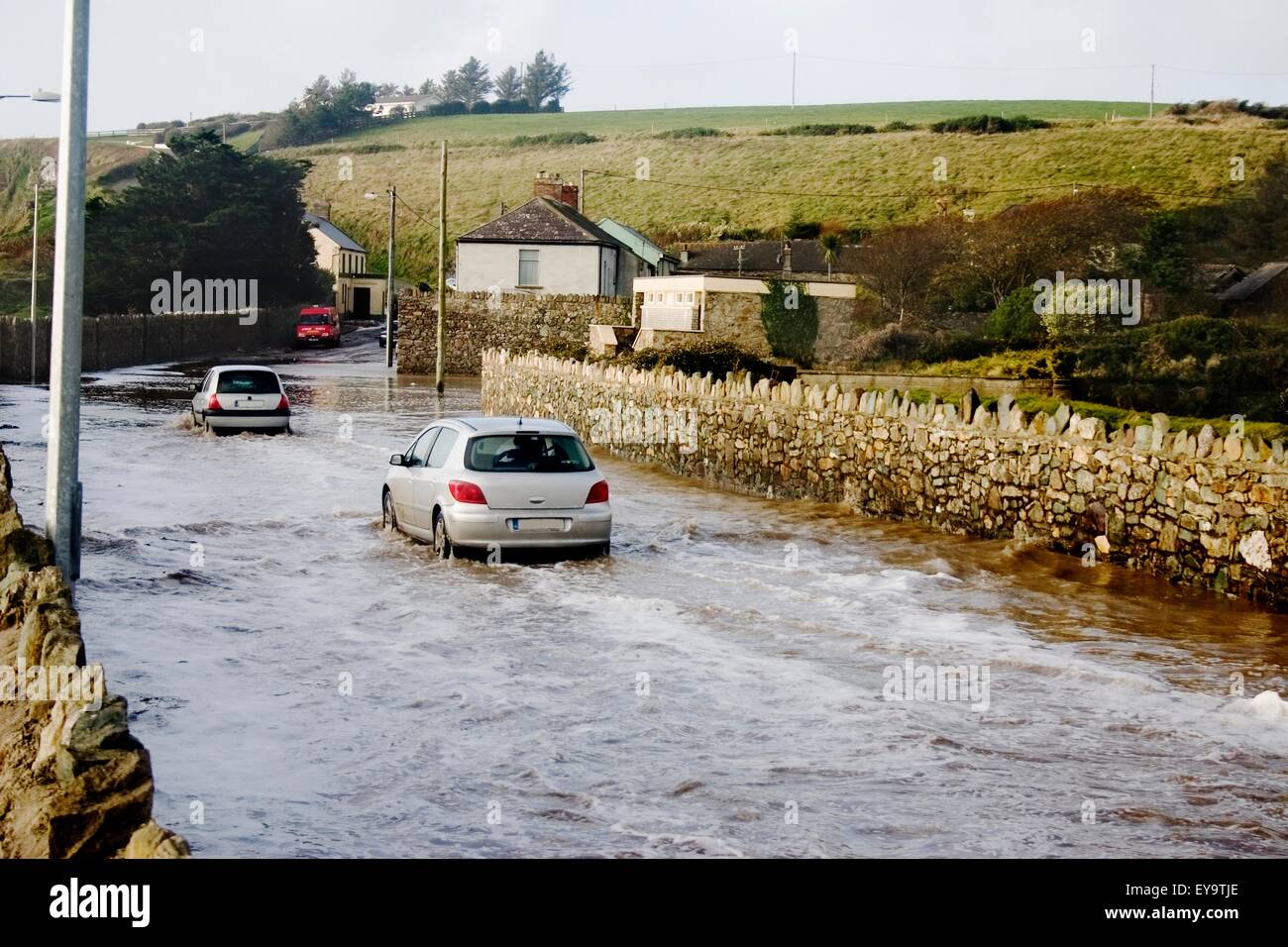 Co Waterford, Ireland, Cars Driving On A Flooded Road Stock Photo Alamy