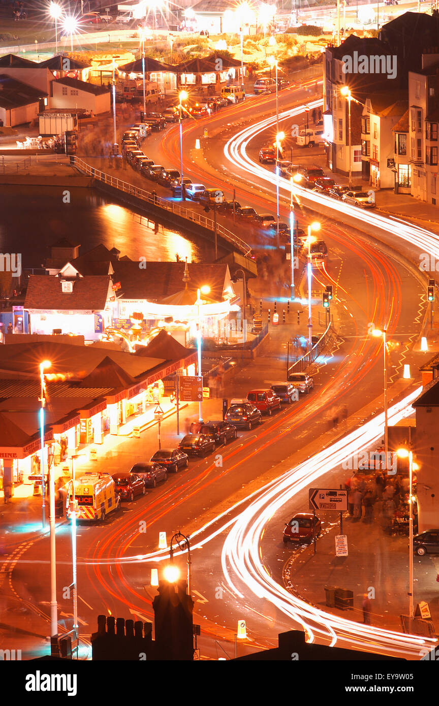 Light Trails On Curved Road At Night, Aerial View Stock Photo