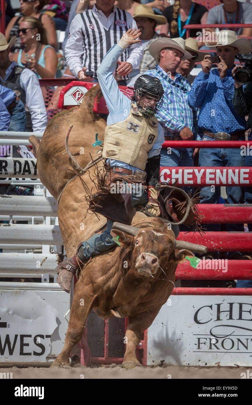 Cheyenne, Wyoming, USA. 24th July, 2015. Bull rider Cain Smith of Pendleton, Oregon emerges from the chute on Let R Rip at the Cheyenne Frontier Days rodeo at Frontier Park Arena July 24, 2015 in Cheyenne, Wyoming. Frontier Days celebrates the cowboy traditions of the west with a rodeo, parade and fair. Stock Photo