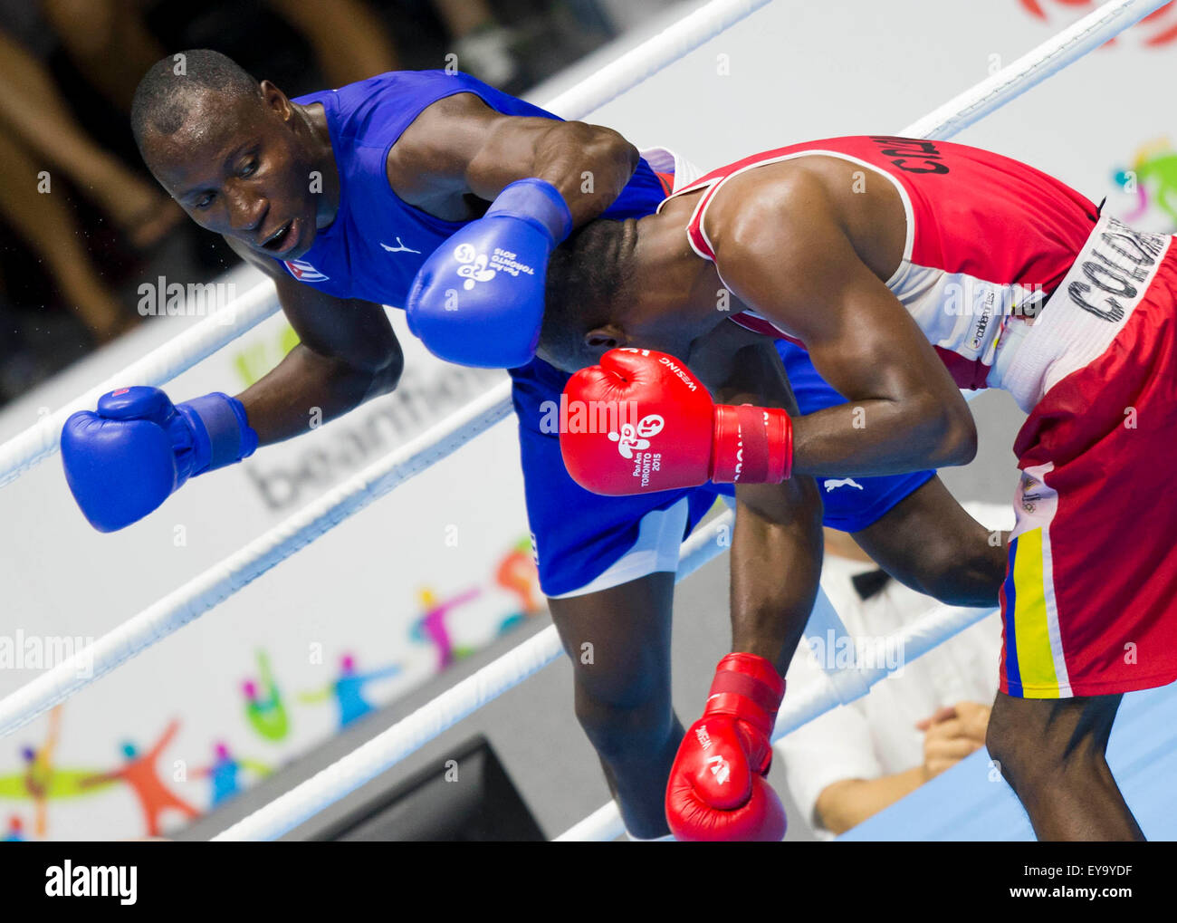Toronto, Canada. 24th July, 2015. Erislandy Savon (L) of Cuba fights against Deivis Julio Blanco of Colombia during the men's 91kg final match of the boxing event at the 17th Pan American Games in Toronto, Canada, July 24, 2015. Erislandy Savon won 2-1 and claimed the title. © Zou Zheng/Xinhua/Alamy Live News Stock Photo