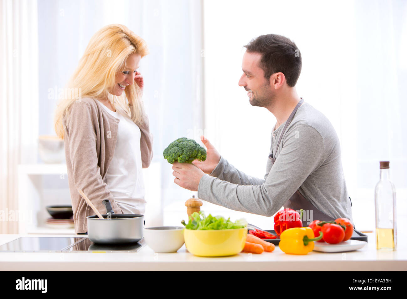 View of a Young attractive couple having fun in the kitchen Stock Photo