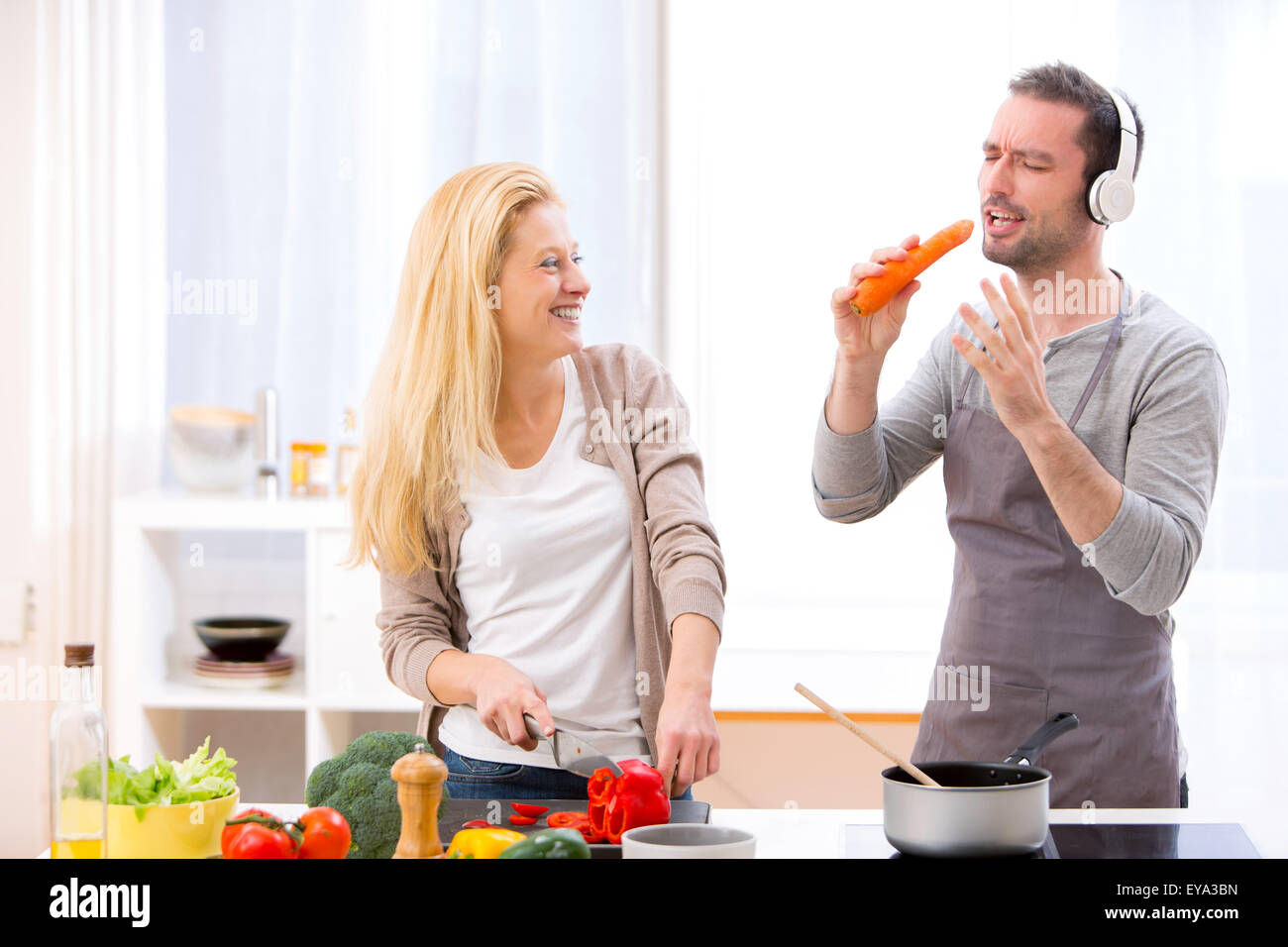 View of a Young attractive couple having fun in the kitchen Stock Photo