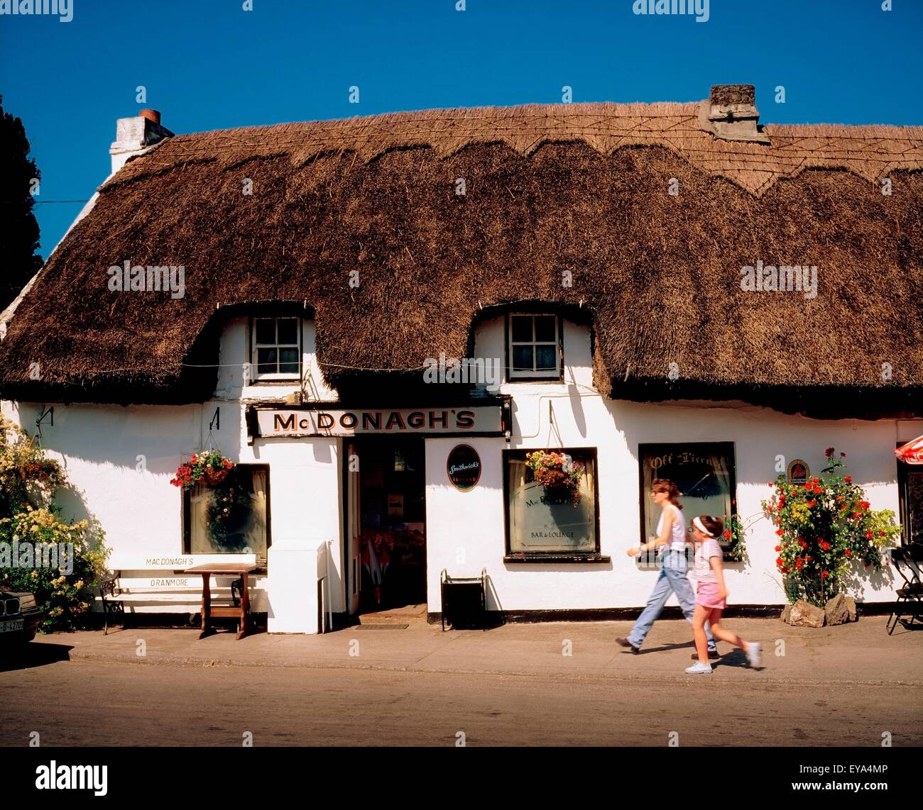 Mcdonagh's Thatched Bar, Oranmore, Co Galway, Ireland; Woman And Girl