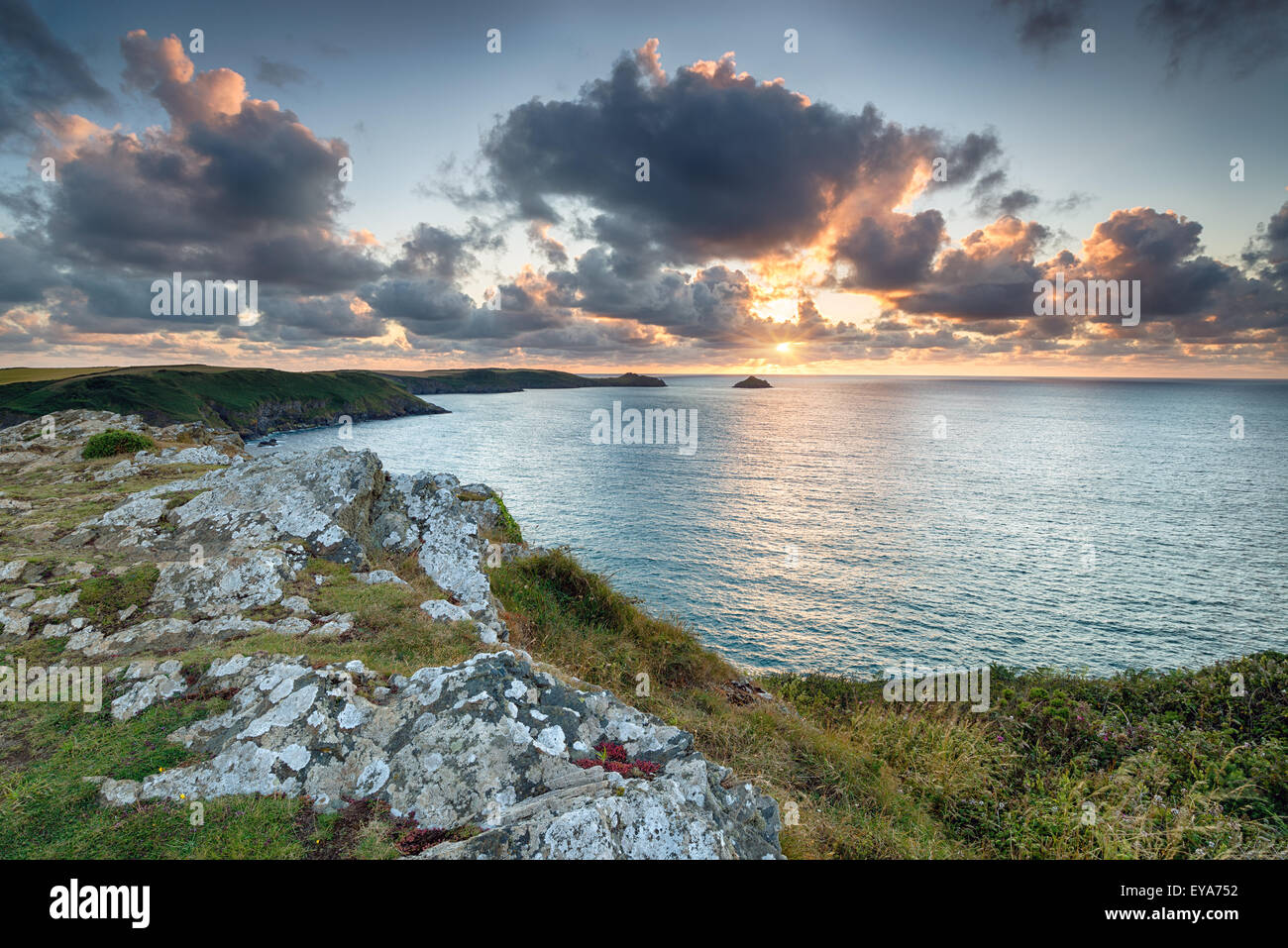 Sunset from the cliffs at Trevan Point above Lundy Bay near Polzeath on the north coast of Cornwall Stock Photo