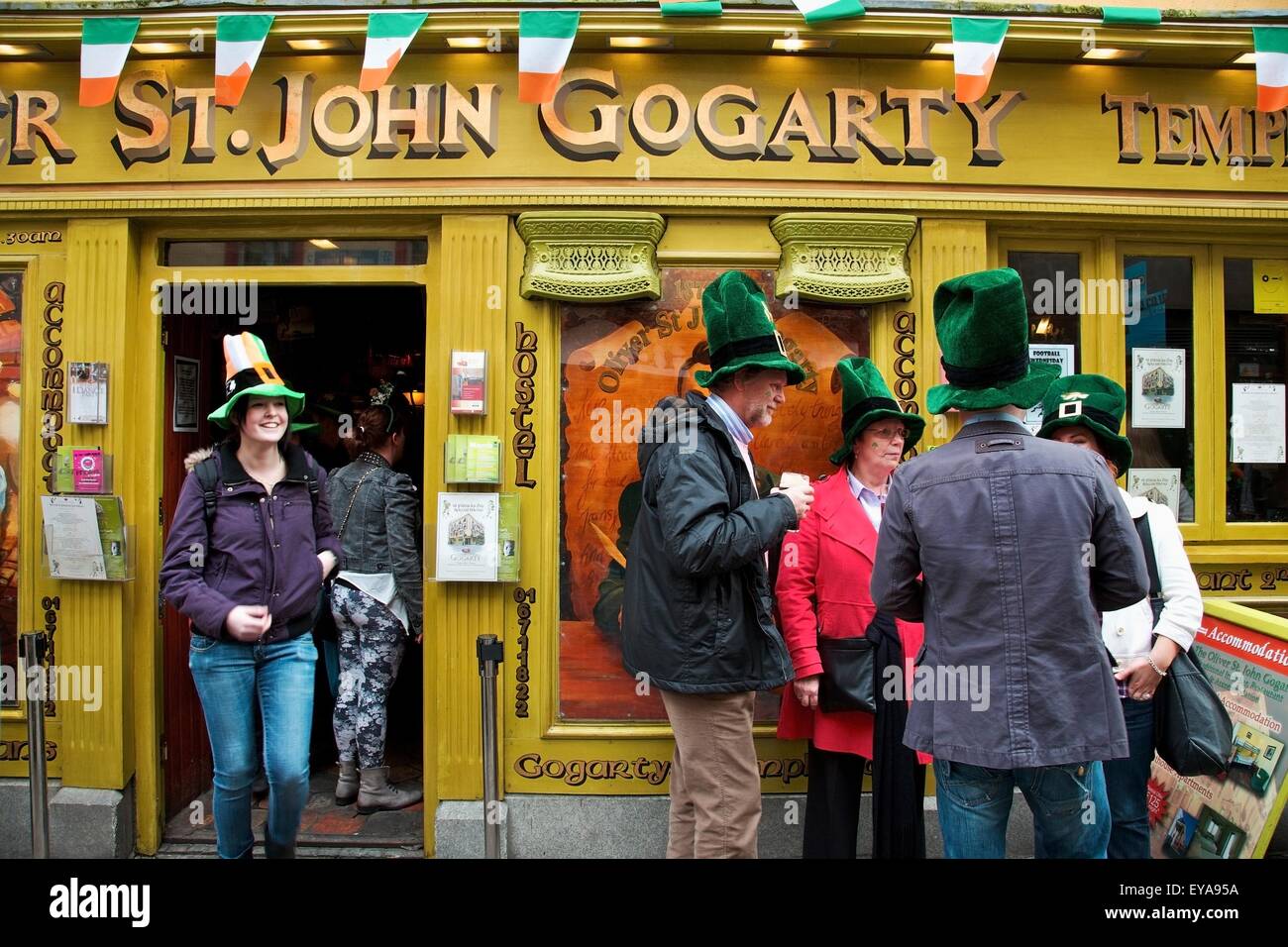 Dublin, Ireland; People Gathered Outside A Store Wearing Big Green Hats