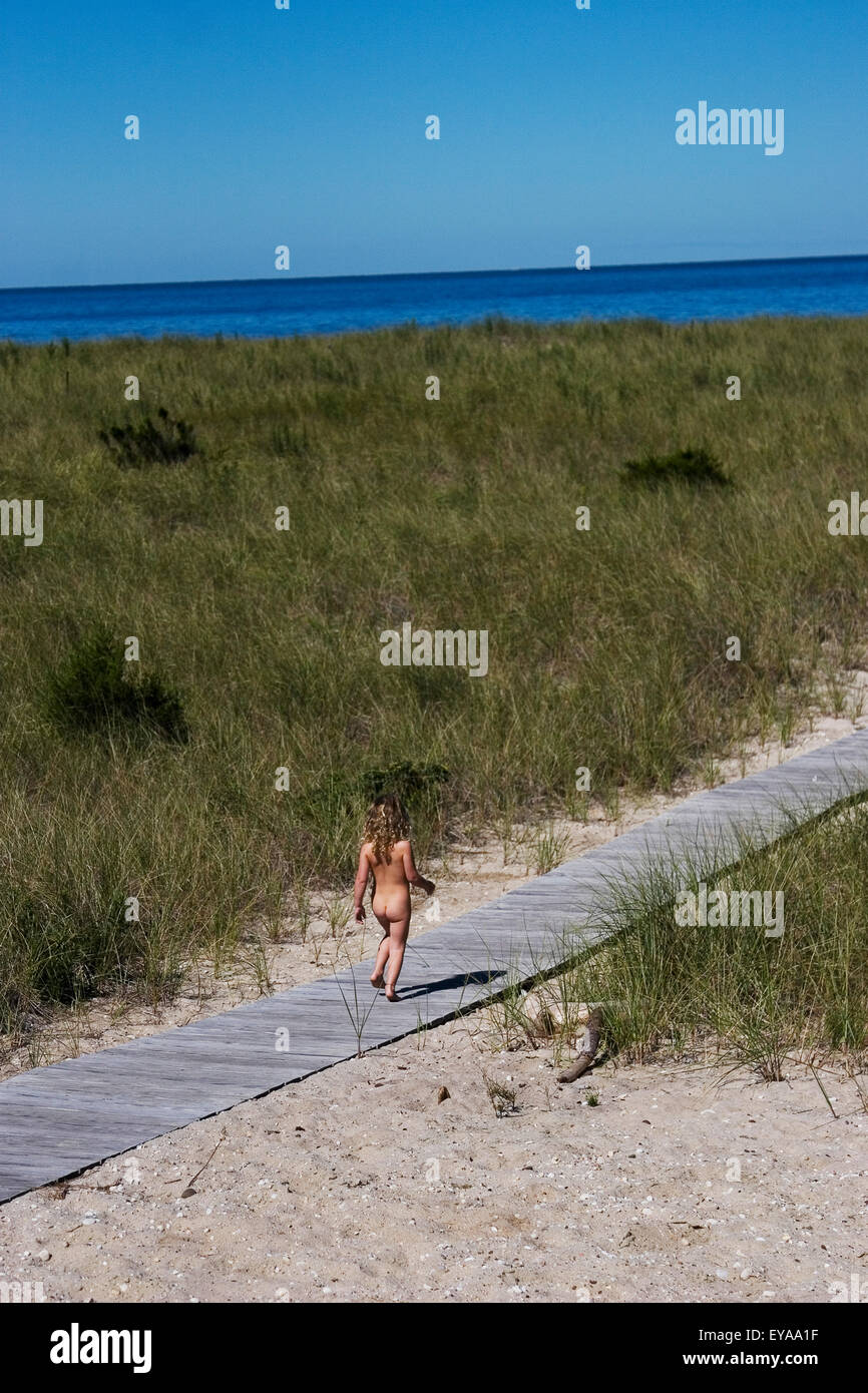 Naked Girl Walking Along Boardwalk Towards Sea, Peconic,North Fork,Long  Island,New York,Usa Stock Photo - Alamy