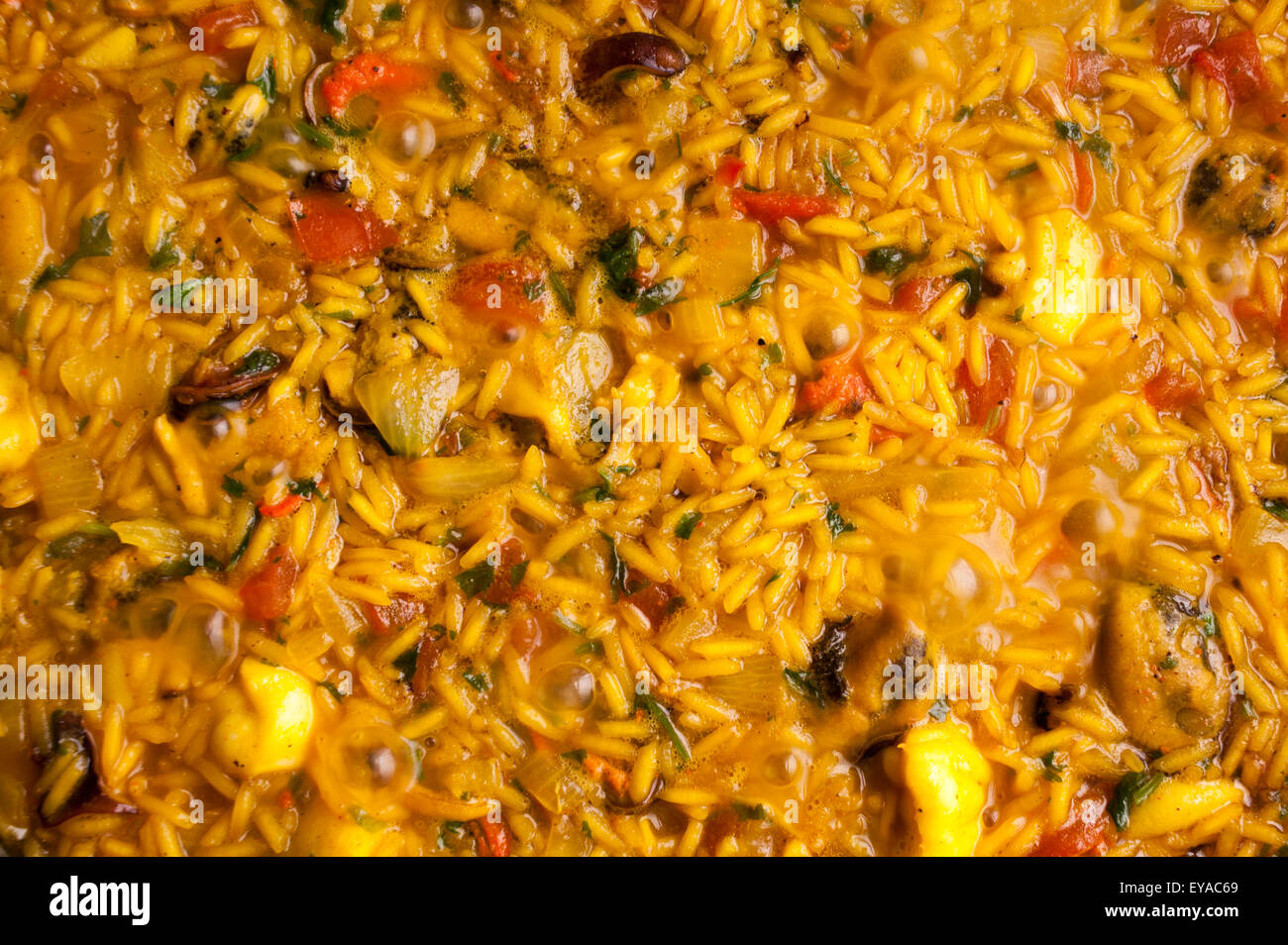 Background of a Paella cooking in the oven Stock Photo Alamy