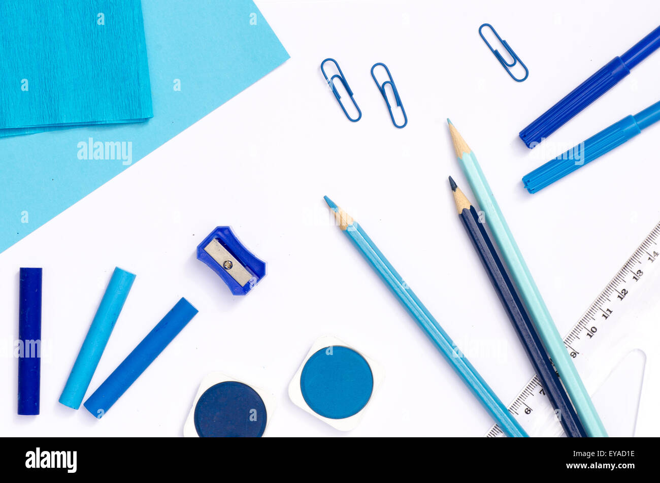 blue color school supplies on white paper background Stock Photo