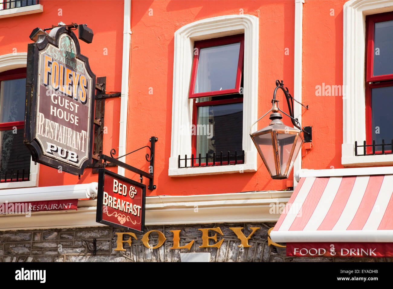Sign Hanging From The Colourful Building Of Foleys Restaurant And Pub; Kenmare, County Kerry, Ireland Stock Photo