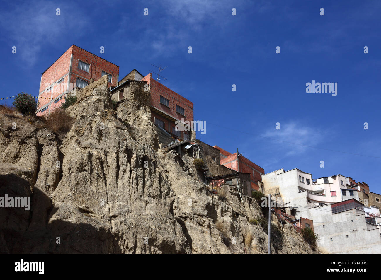 Precariously built houses (probably without any sort of authorisation) on an unstable steep earth / soil hillside on Calle Belzu, La Paz, Bolivia Stock Photo