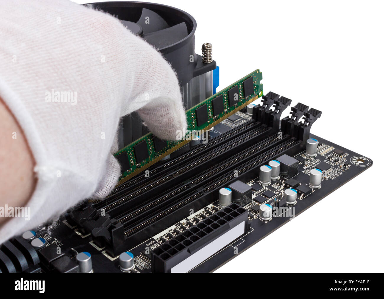 Installing memory module in DIMM slot on modern PC computer motherboard Stock Photo