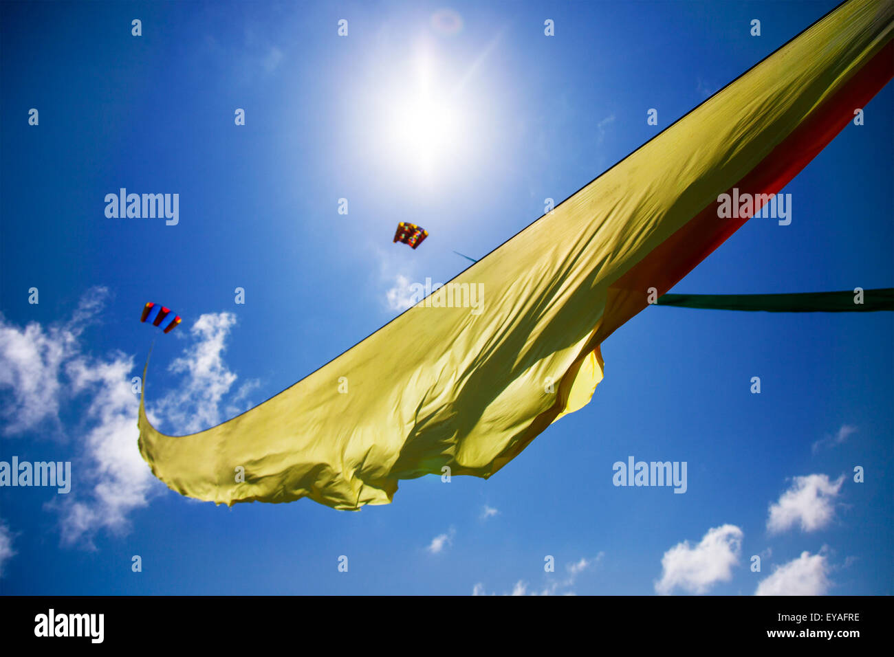 Colourful; curved flying kite sail in the skies at Lytham, Lancashire