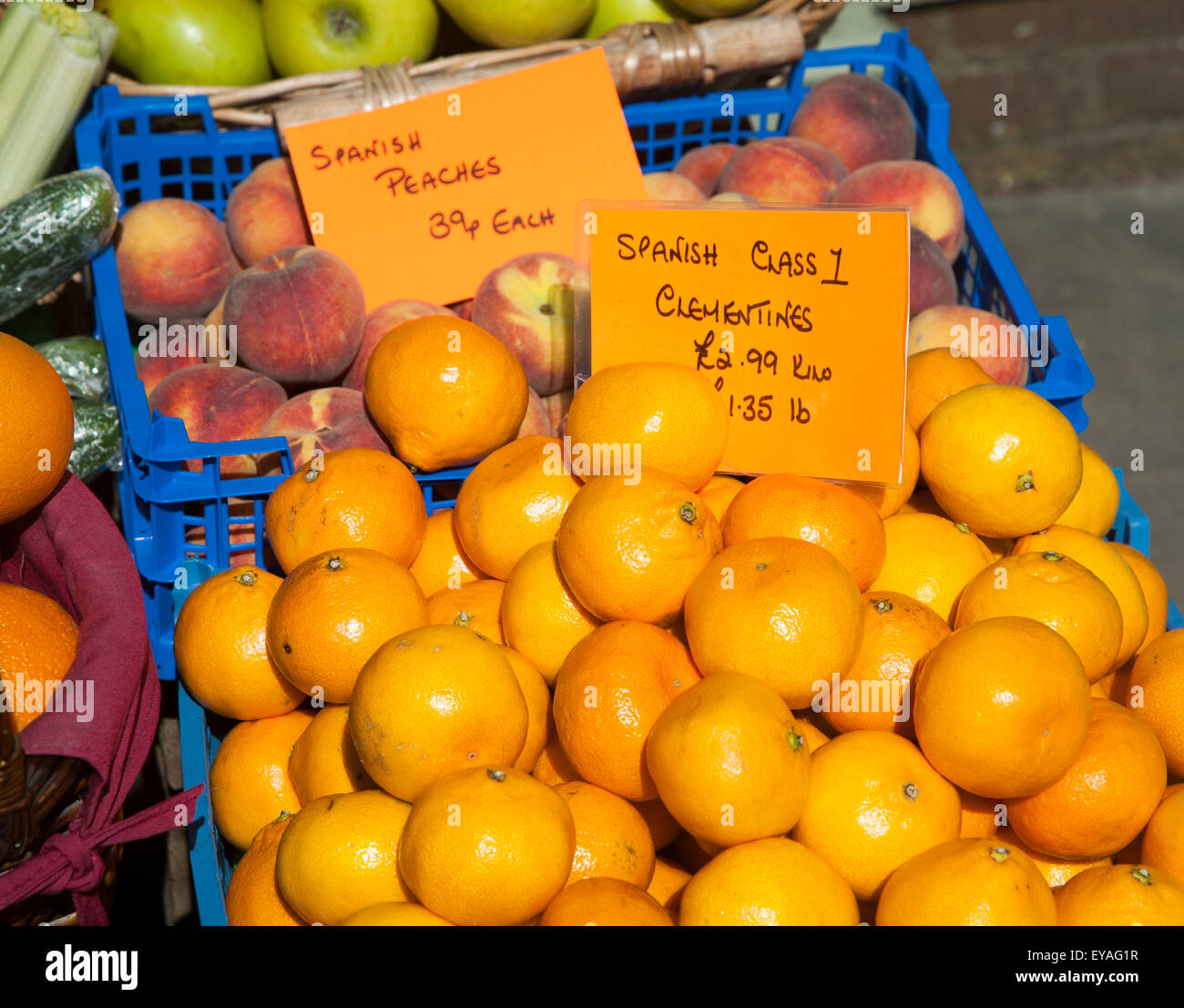 Close up of Spanish peaches and oranges for sale, England, UK Stock
