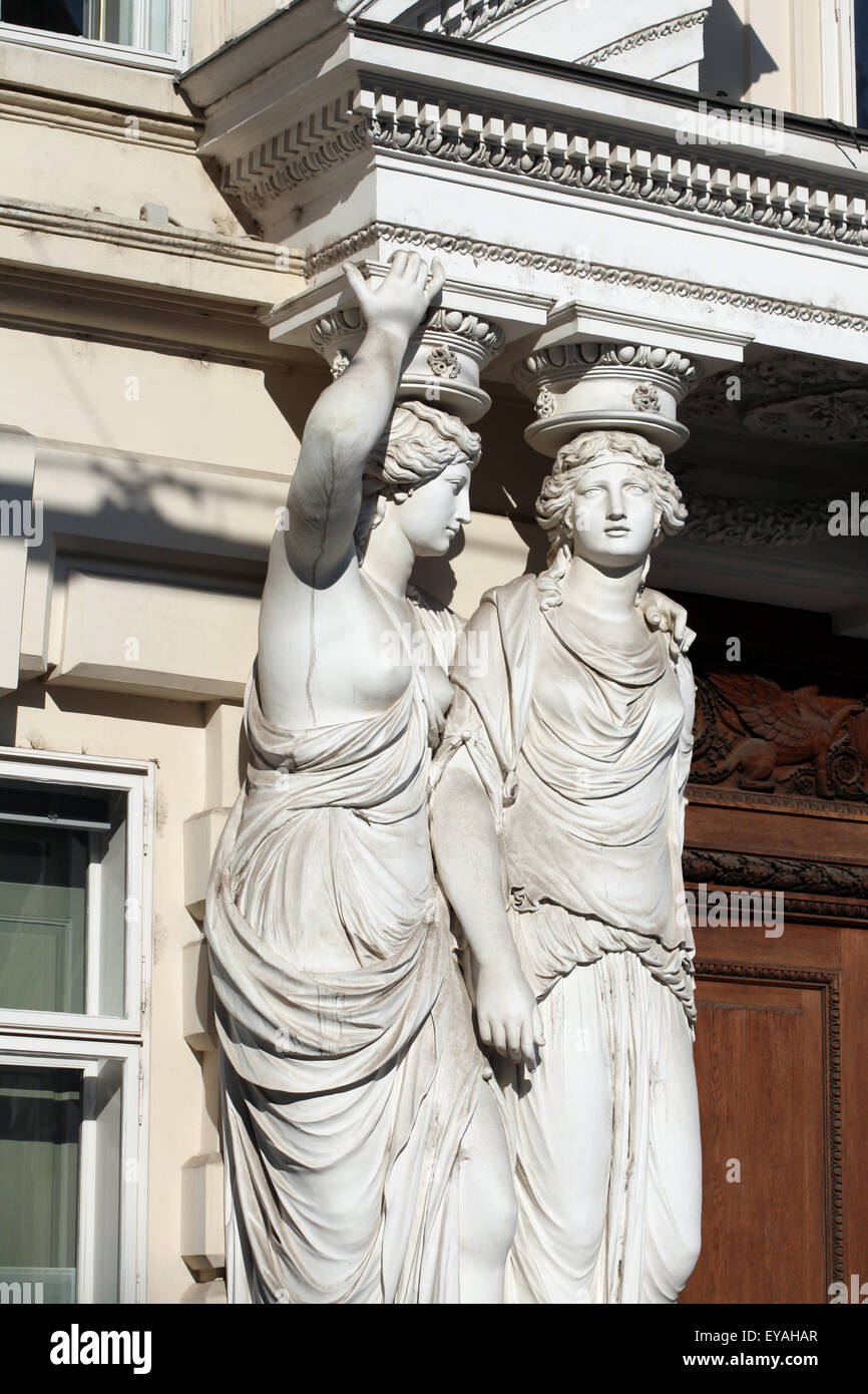 Two caryatids by Austrian sculptor Franz Anton von Zauner support the main entrance to the Palais Pallavicini at Josefsplatz in Vienna, Austria. Stock Photo