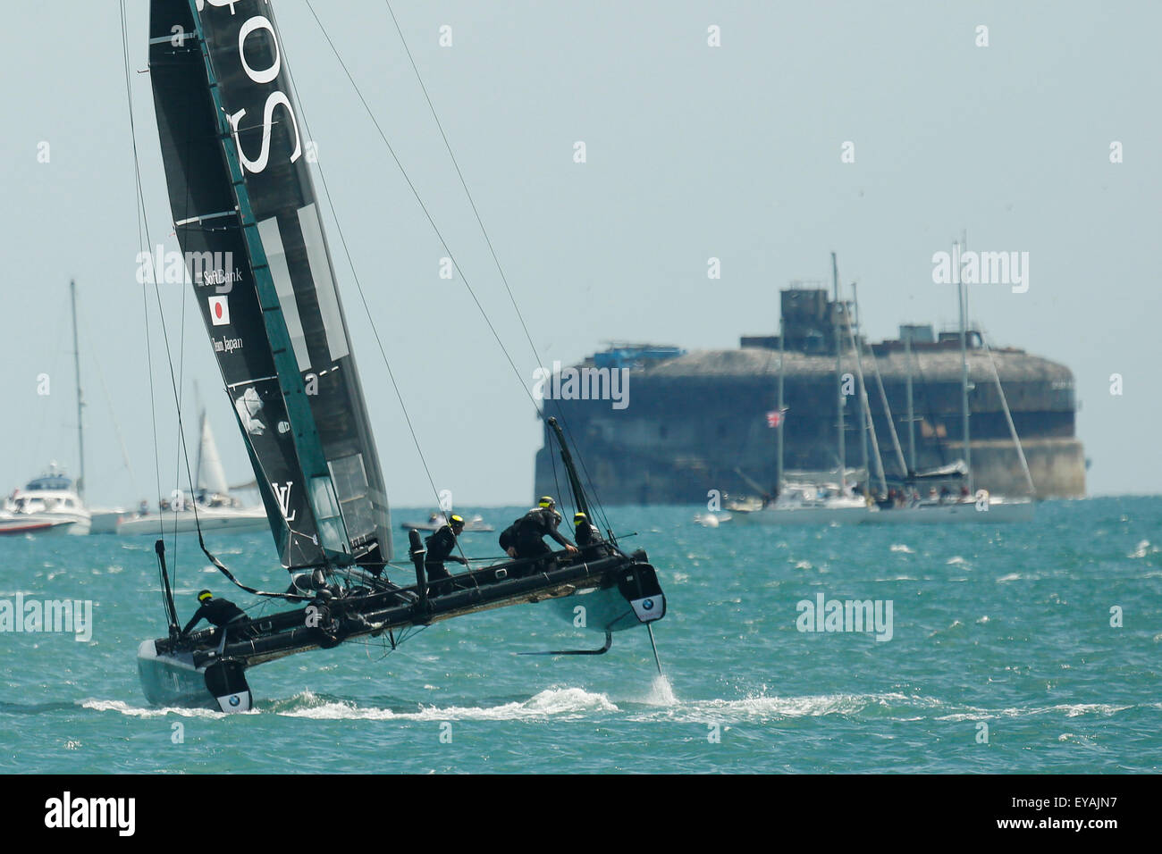Portsmouth, UK. 25th July, 2015. SoftBank Team Japan compete in the first official race of the 35th America's Cup World Series Races at Portsmouth in Hampshire, UK Saturday July 25, 2015. The 2015 Portsmouth racing of the Louis Vuitton America's Cup World Series counts towards the qualifiers and playoffs which determine the challenger to compete against the title holders Oracle Team USA in 2017. Credit:  Luke MacGregor/Alamy Live News Stock Photo