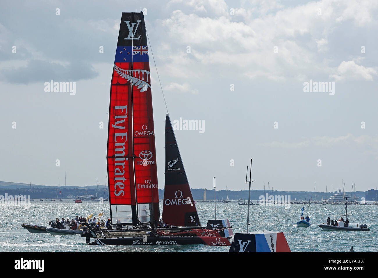 Portsmouth, UK. 25th July, 2015. Emirates New Zealand wins the second race of the 35th America's Cup World Series Races at Portsmouth in Hampshire, UK Saturday July 25, 2015. The 2015 Portsmouth racing of the Louis Vuitton America's Cup World Series counts towards the qualifiers and playoffs which determine the challenger to compete against the title holders Oracle Team USA in 2017. Credit:  Luke MacGregor/Alamy Live News Stock Photo