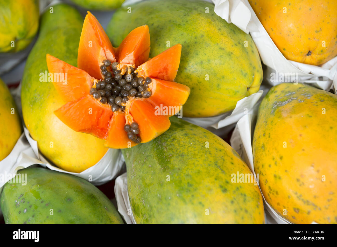 Fresh cut juicy tropical papaya mamao fruit with seeds at Brazilian