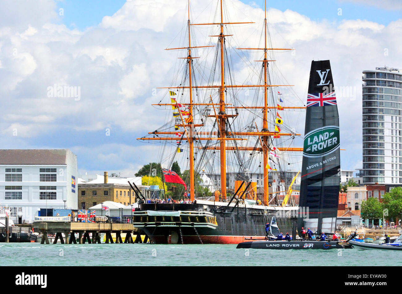 HMS Warrior berthed on the waterfront in Portsmouth with Land Rover BAR