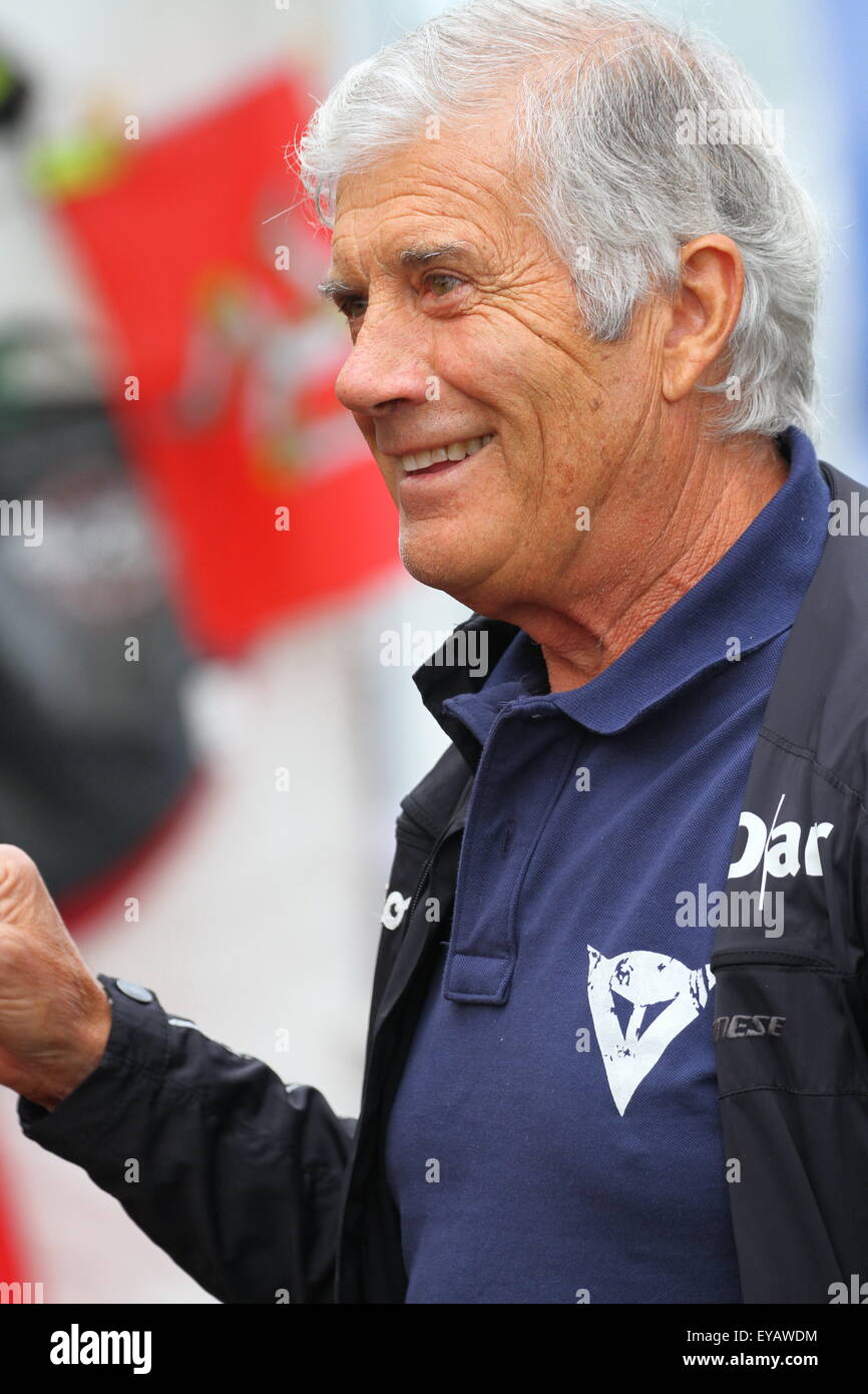 Fifteeen times world motorcycle racing champion Giacomo Agostini has joined thousands of bike racing fans from across the globe at the historic Cadwell Park motor racing circuit in Lincolnshire UK to celebrate the Cadwell Park International Classic, the world's finest gathering of historic racing motorcycles in recent history. Stock Photo