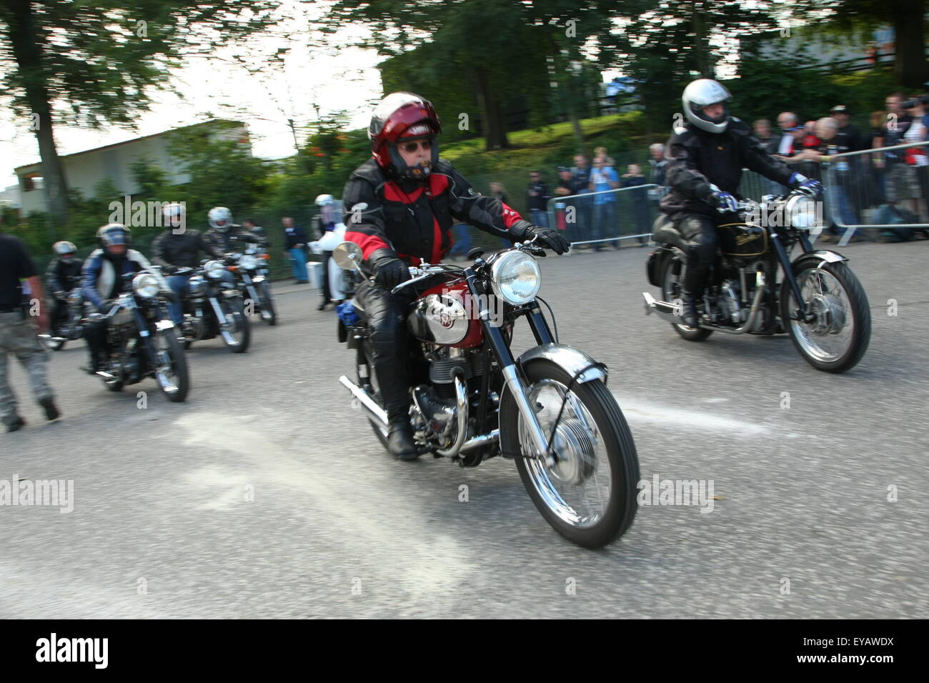 Classic bike fans from around the globe are gathering this weekend at the historic Cadwell Park motor racing circuit in Lincolnshire UK to witness the greatest gathering of historic racing motorcycles in recent history. Stock Photo