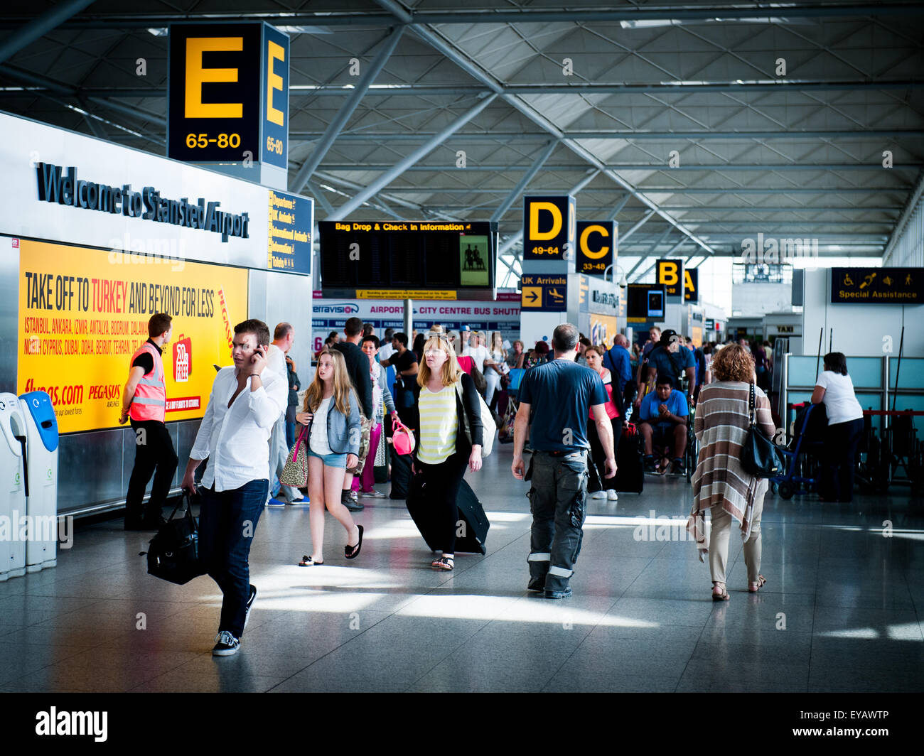 passengers in the departures area at London Stansted Airport, UK Stock Photo