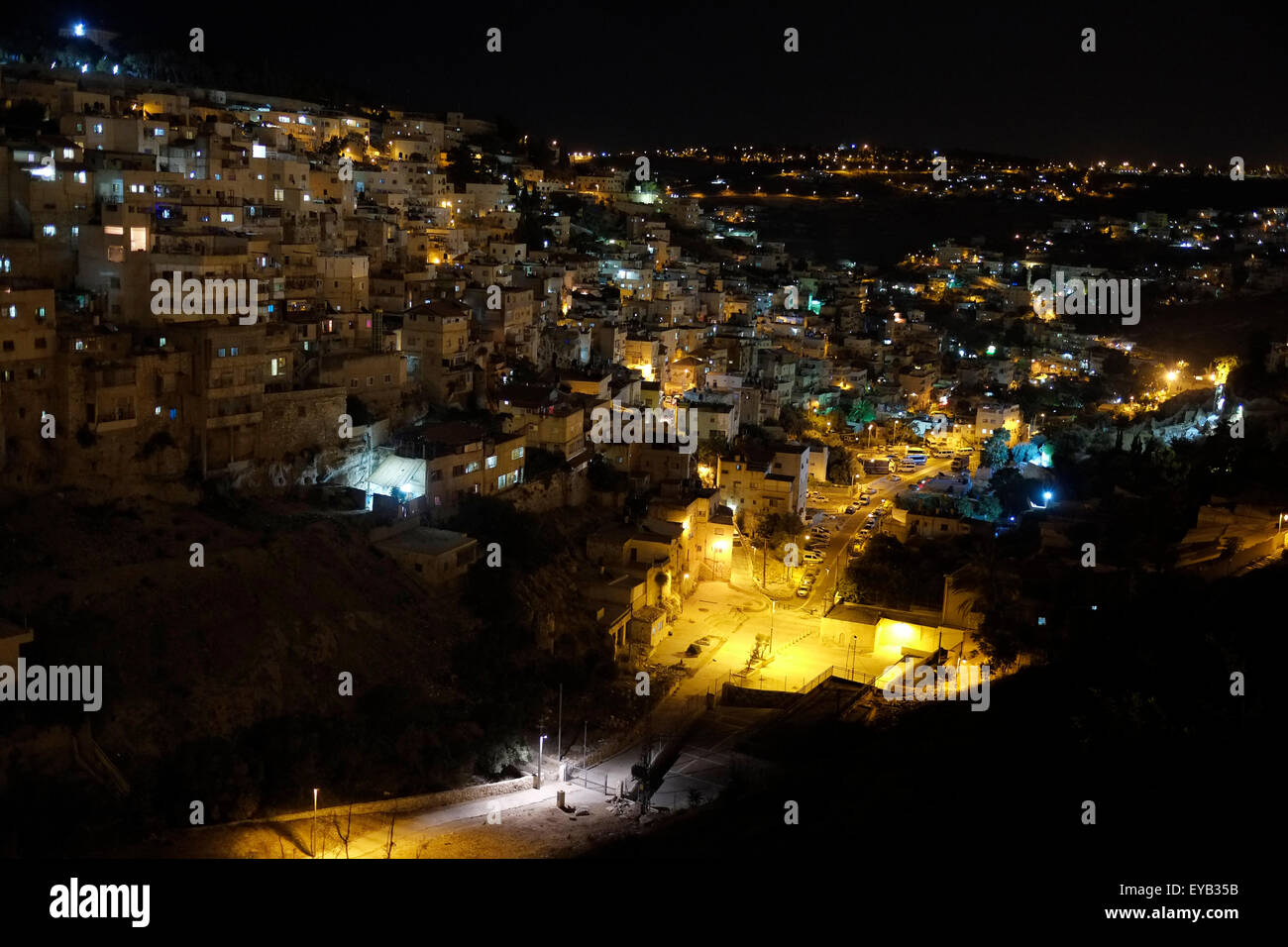 View at night of the Palestinian neighborhood of Silwan or Siloam a predominantly Palestinian neighborhood on the outskirts of the Old City of Jerusalem Israel Stock Photo