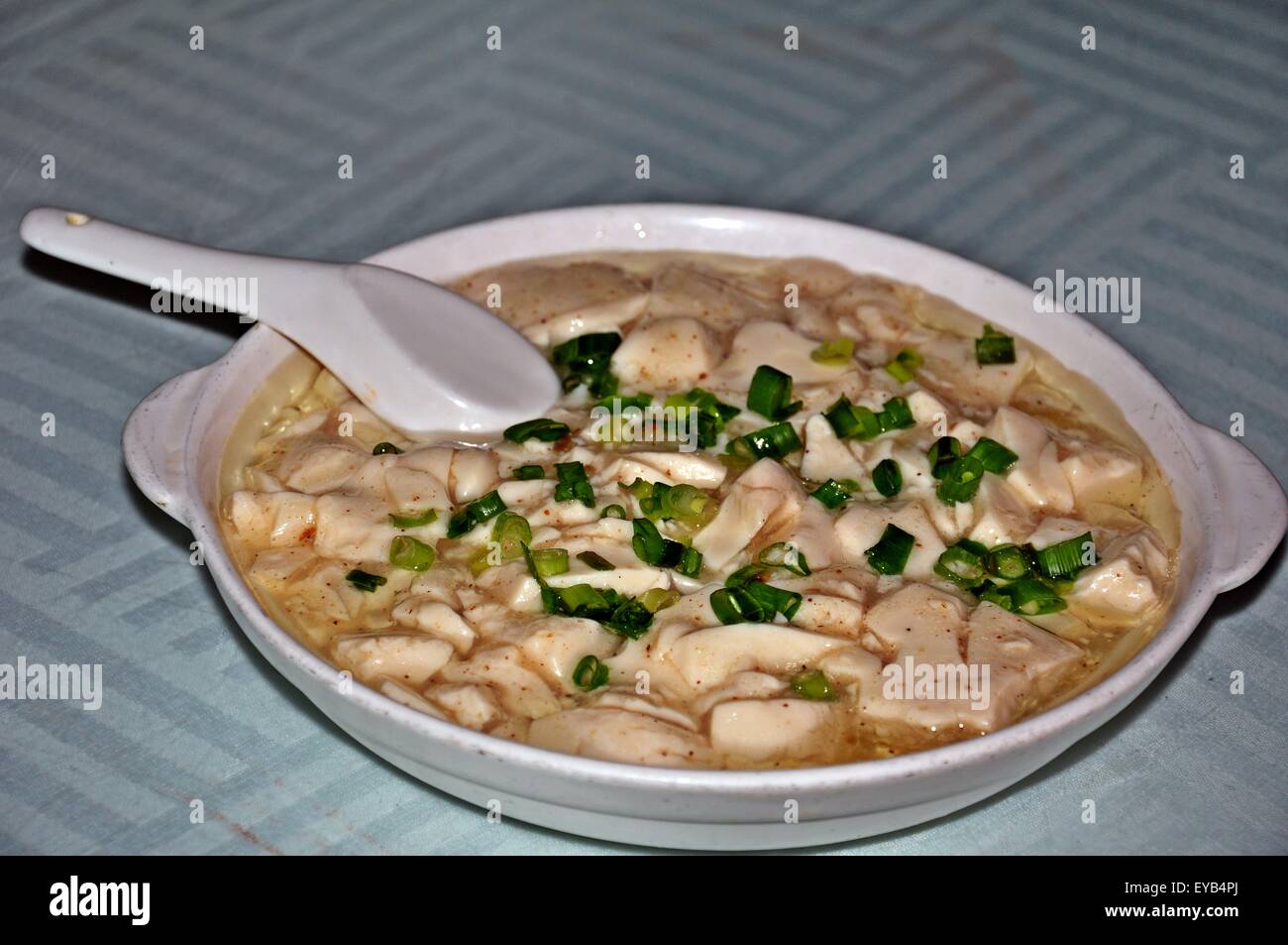 delicious spicy white tauhu with gravy served in the white big bowl Stock Photo