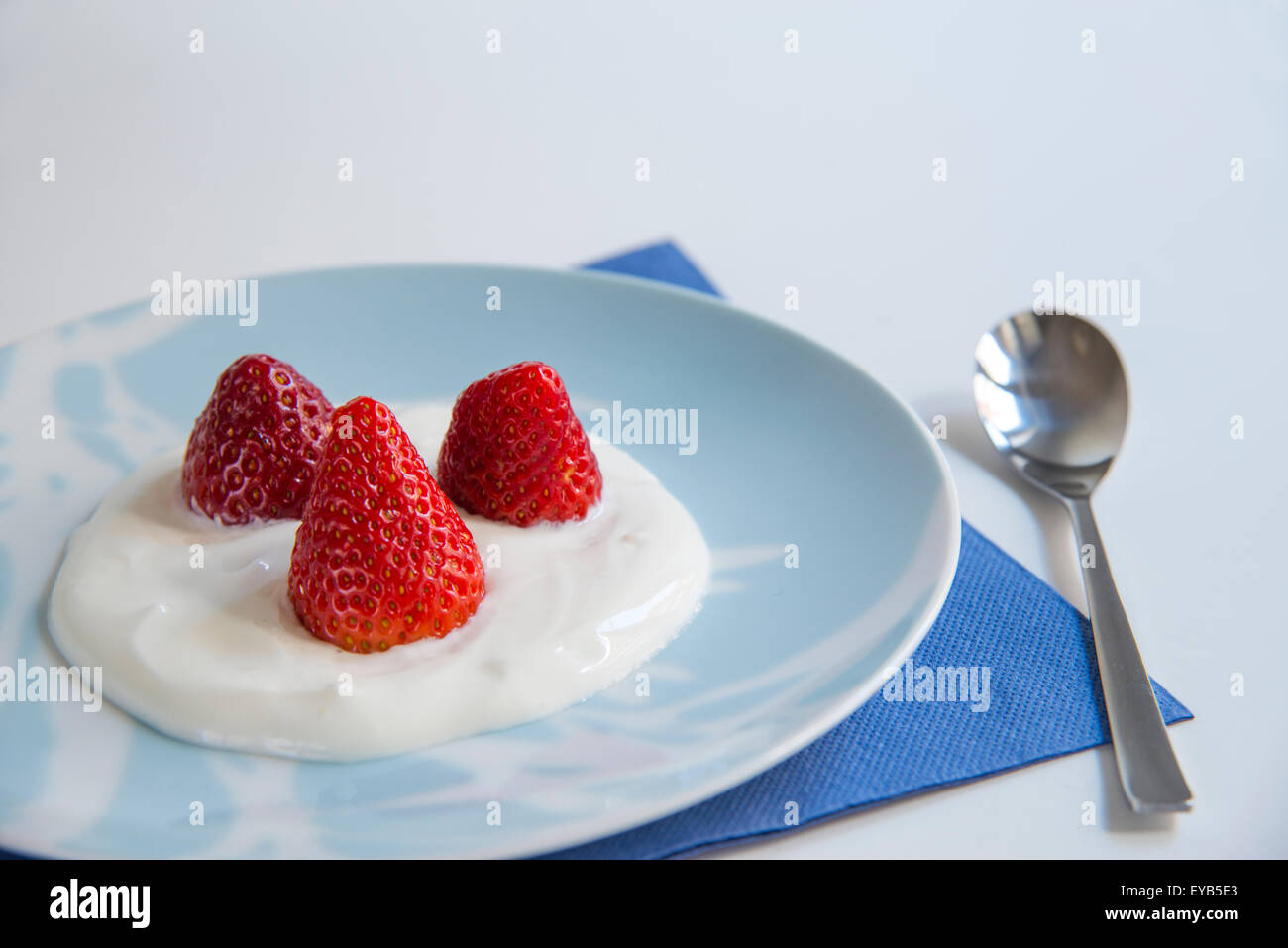 Strawberries with cream. Close view. Stock Photo