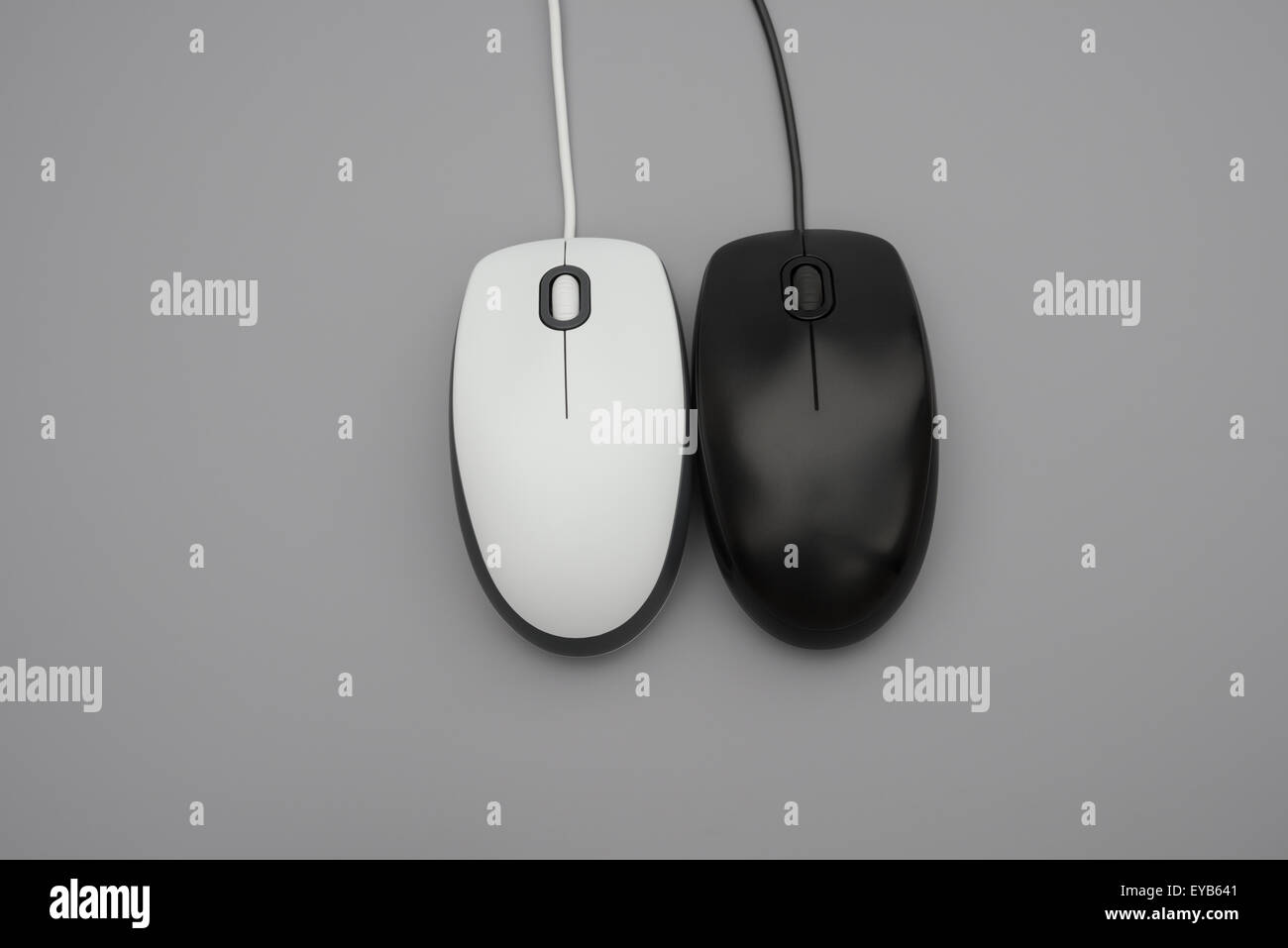 white and black mouses with cables on grey background Stock Photo Alamy