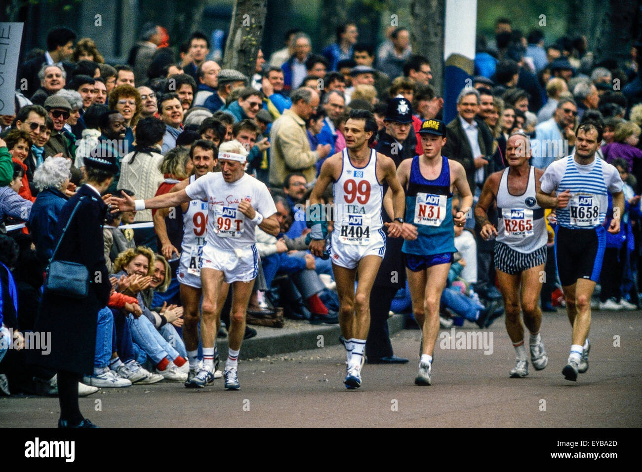 Jimmy Savile running along The Mall at the London Marathon 1989 Stock Photo