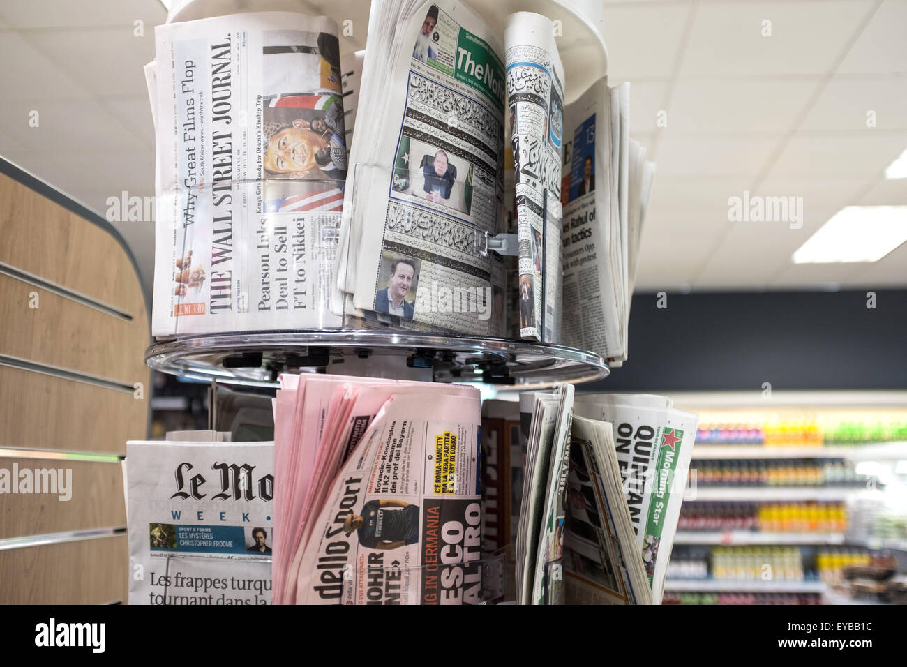 A selection of foreign newspapers on sale Stock Photo